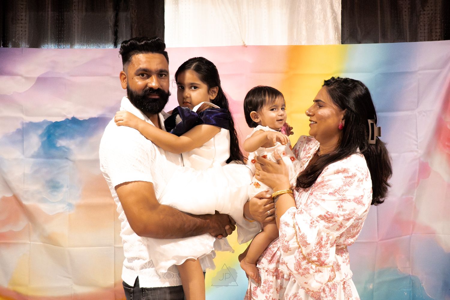 A sequence of dance poses showing a couple in coordinated white and pink outfits against a colorful backdrop.