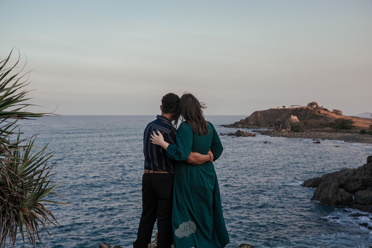 A series of scenic coastal views showing rocky cliffs and blue ocean waters at sunset.