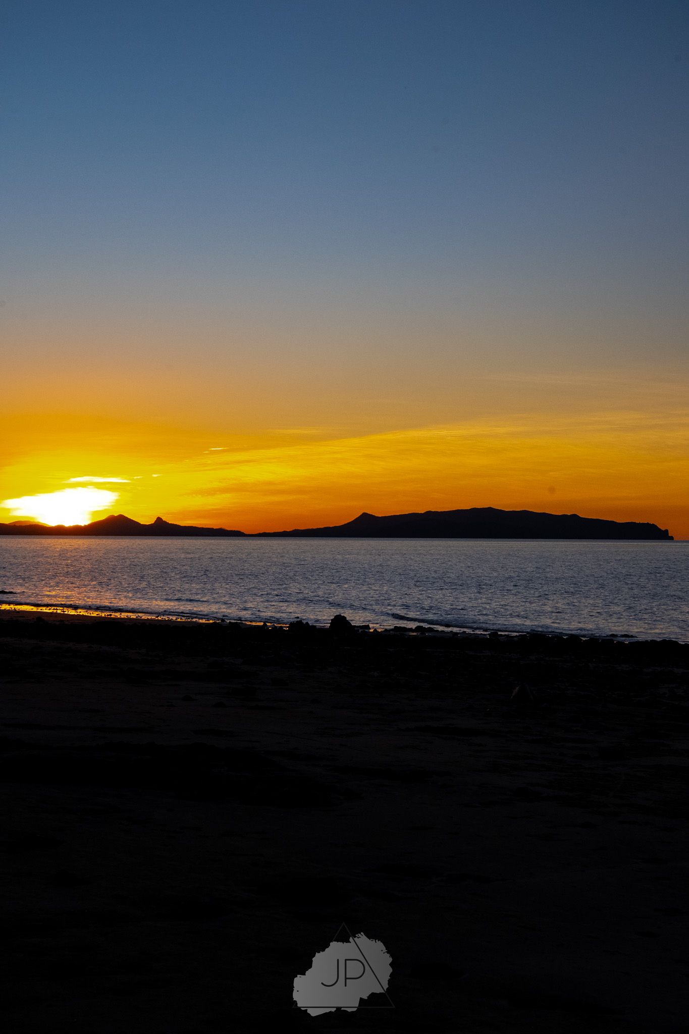 Stunning sequence of sunset photos showing golden sky and silhouetted mountains over ocean horizon.