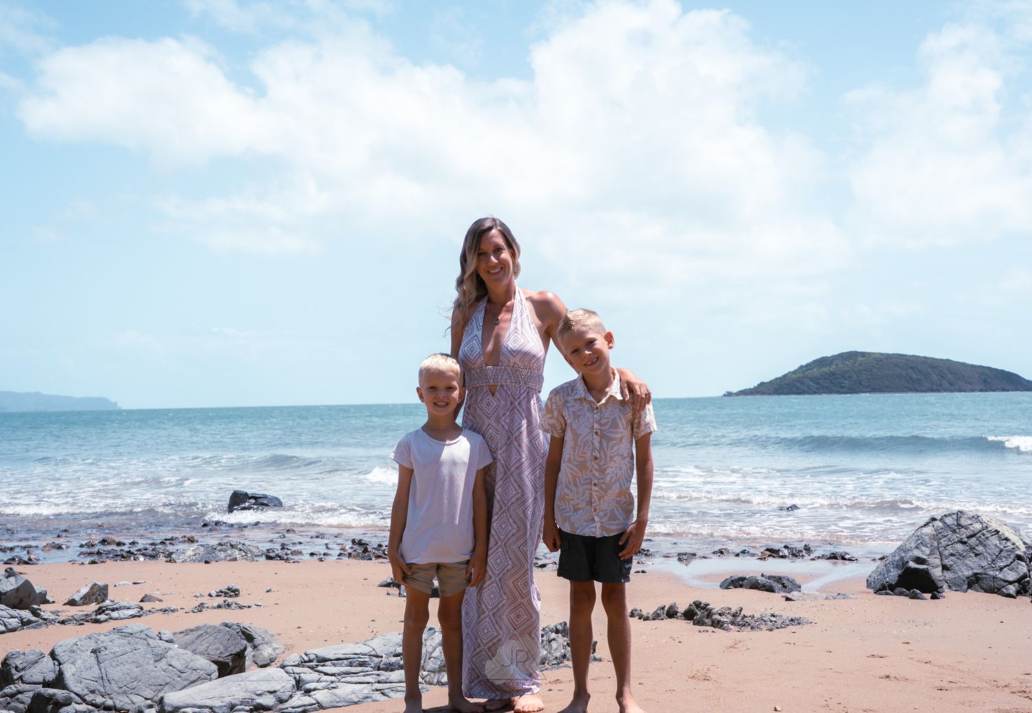 A series of beach vacation photos showing people enjoying a sunny day by the ocean with waves and rocky shoreline.