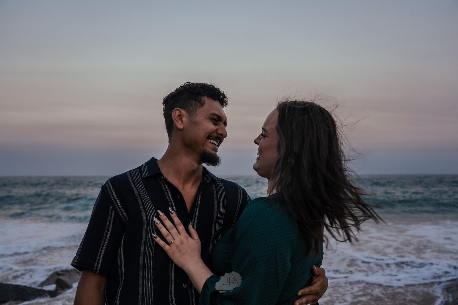 A series of romantic beach photos showing couples embracing and laughing together at sunset by the ocean waves.