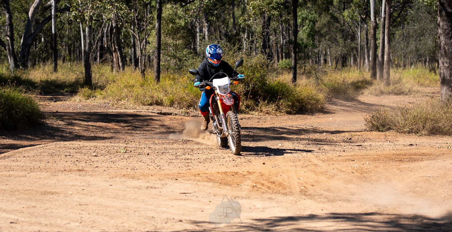 Six photos showing a dusty mountain biking trail winding through a sparse wooded forest terrain.