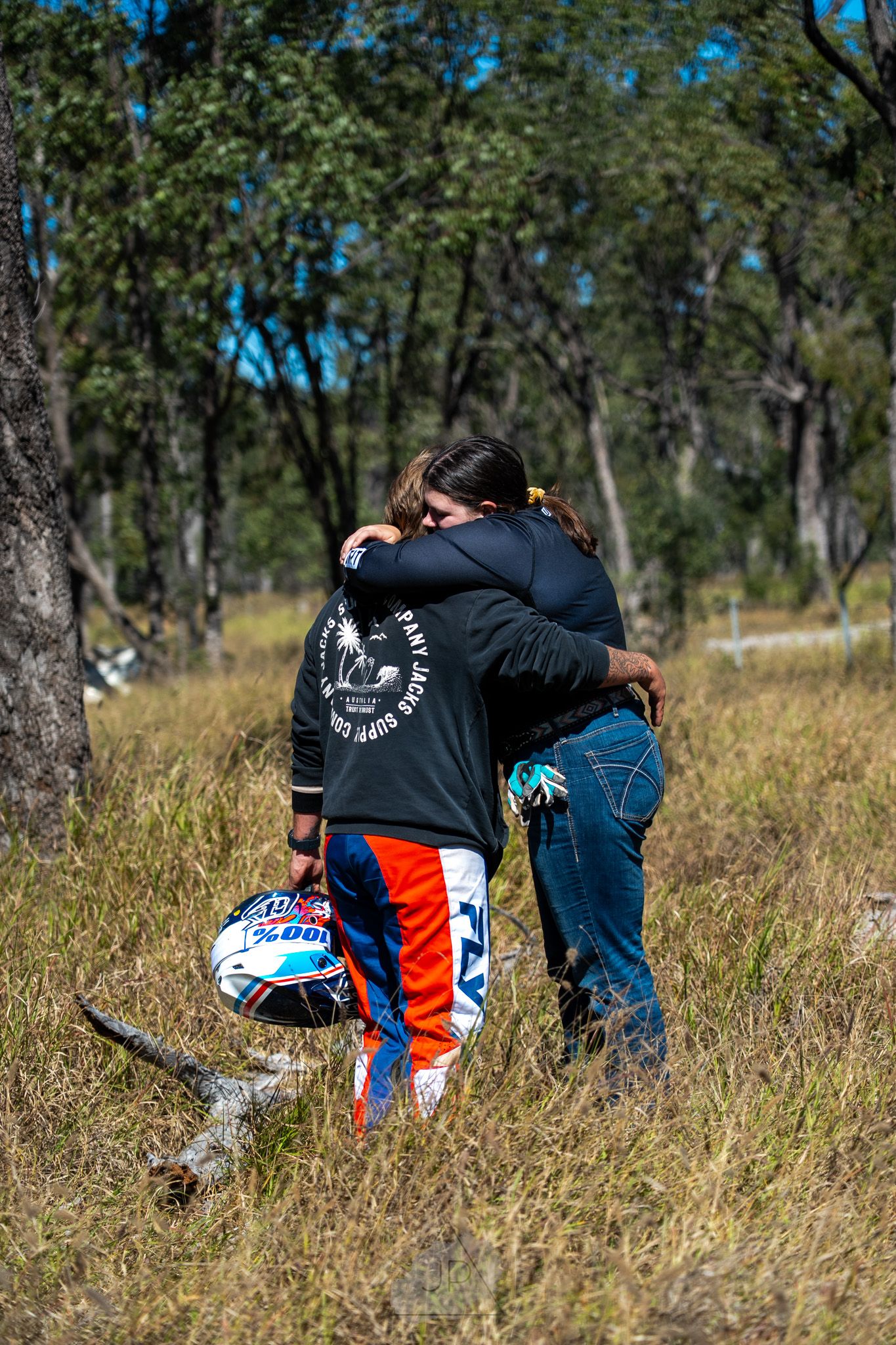 Sequence of motocross riders crashing and tumbling down a grassy hillside during an off-road race competition.