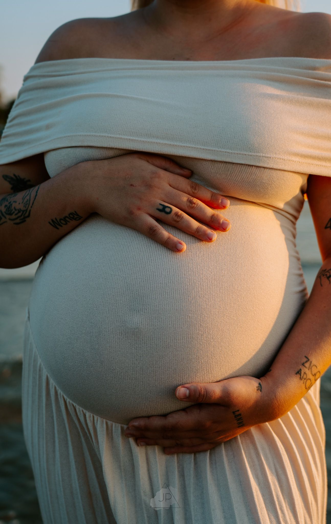 A series of photos showing hands gently resting on a pregnant belly in soft, natural lighting.