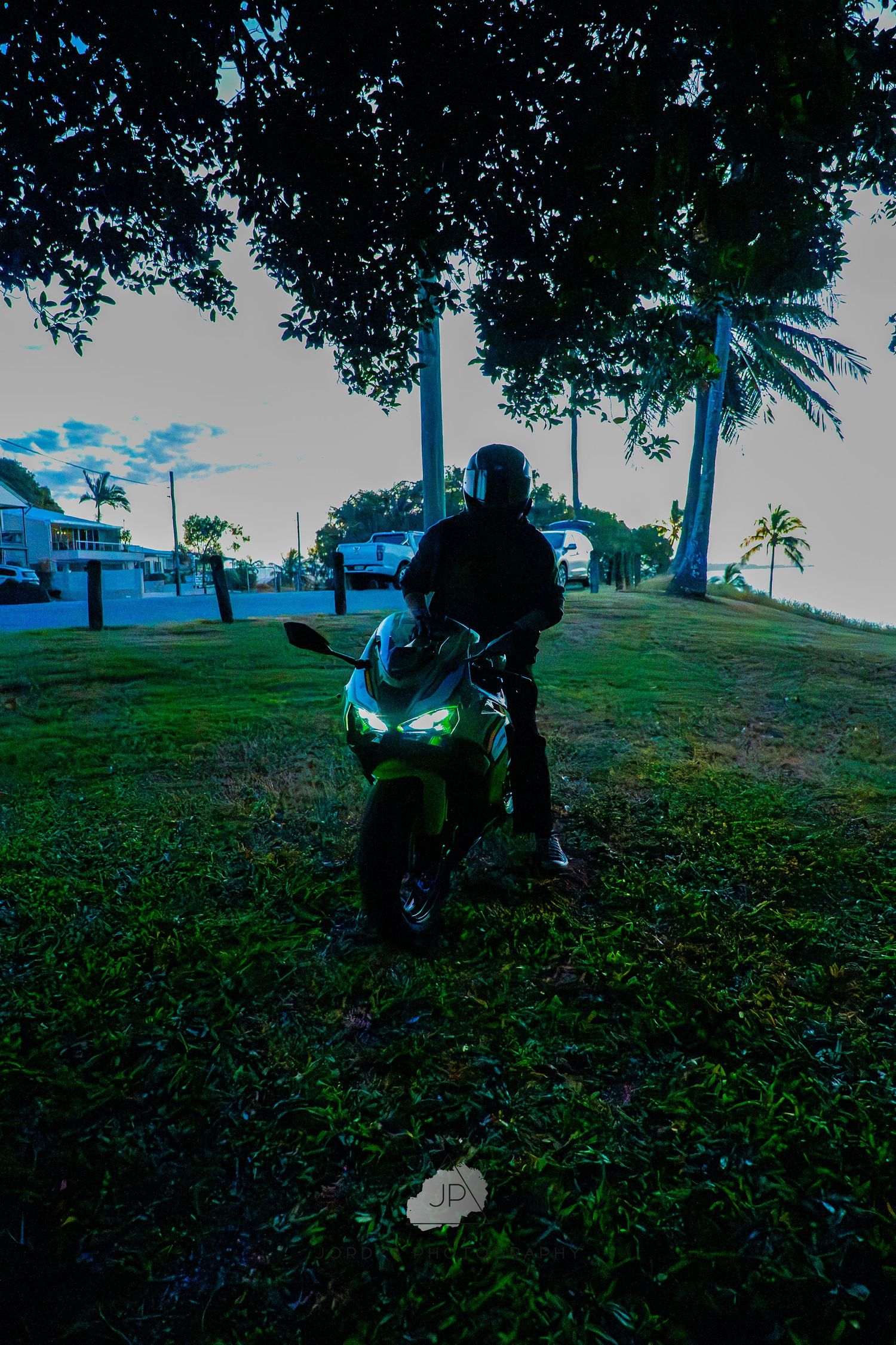 A sequence of photos showing a person in a park searching through grass in low light conditions, seemingly looking for something.