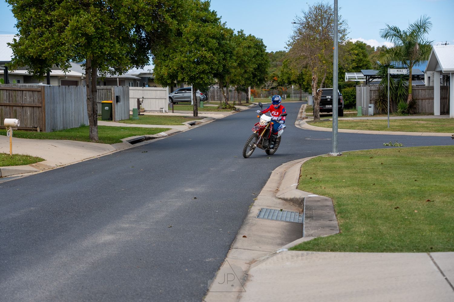 A series of similar images showing suburban street views with homes, driveways and asphalt roads in daylight conditions.
