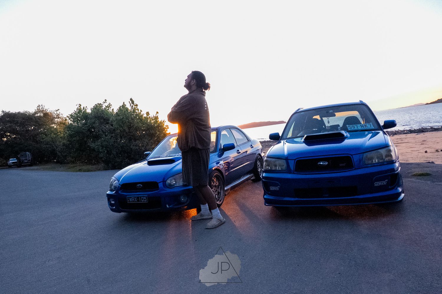 A collage of blue Subaru WRX cars shown at sunset in different angles and poses.