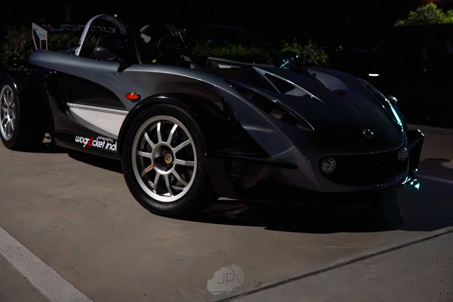 A row of sleek black luxury sports cars parked in line showcasing their high-end design and performance styling.