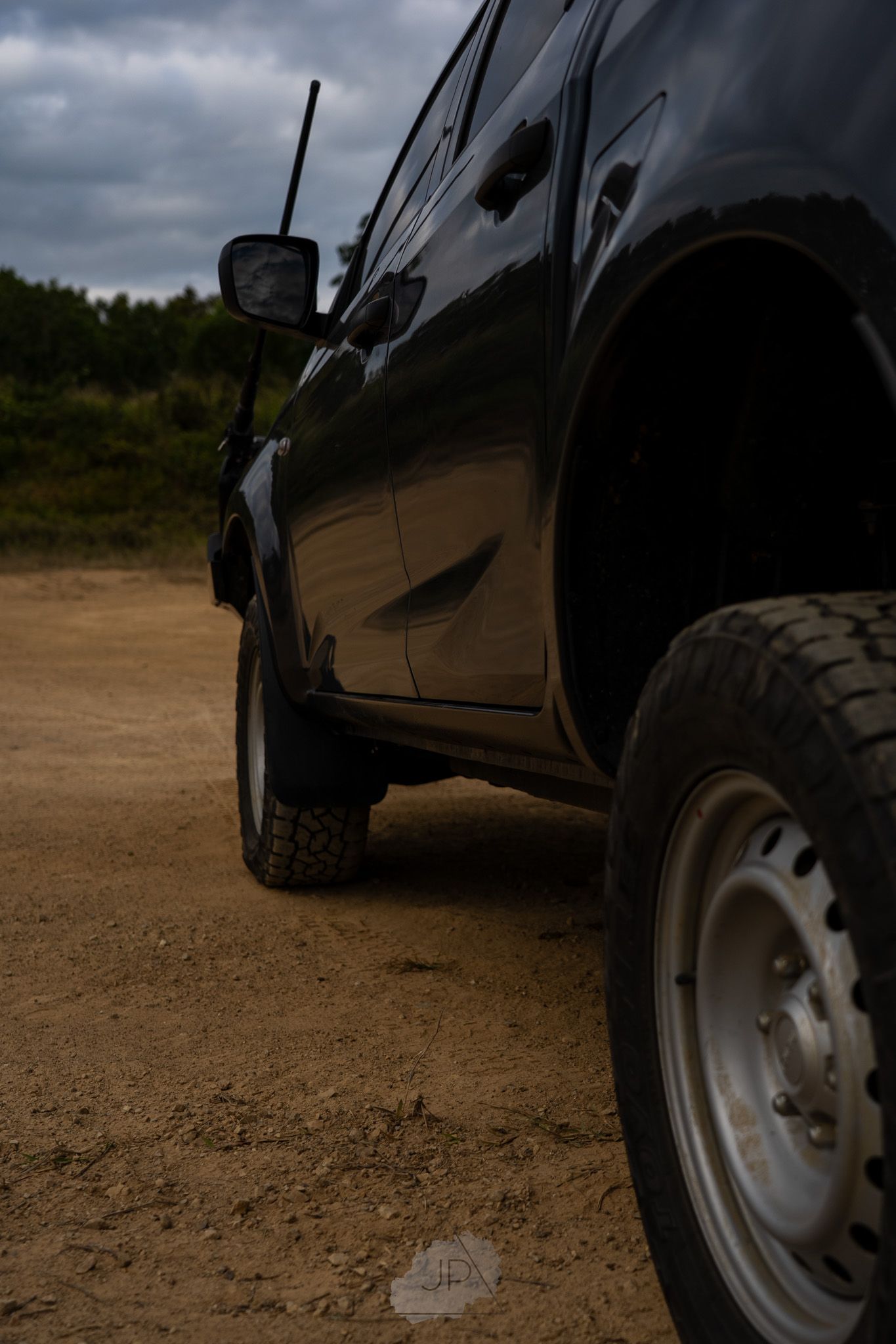 Close-up collage of black vehicle tires on dirt terrain showing different angles of off-road wheels.