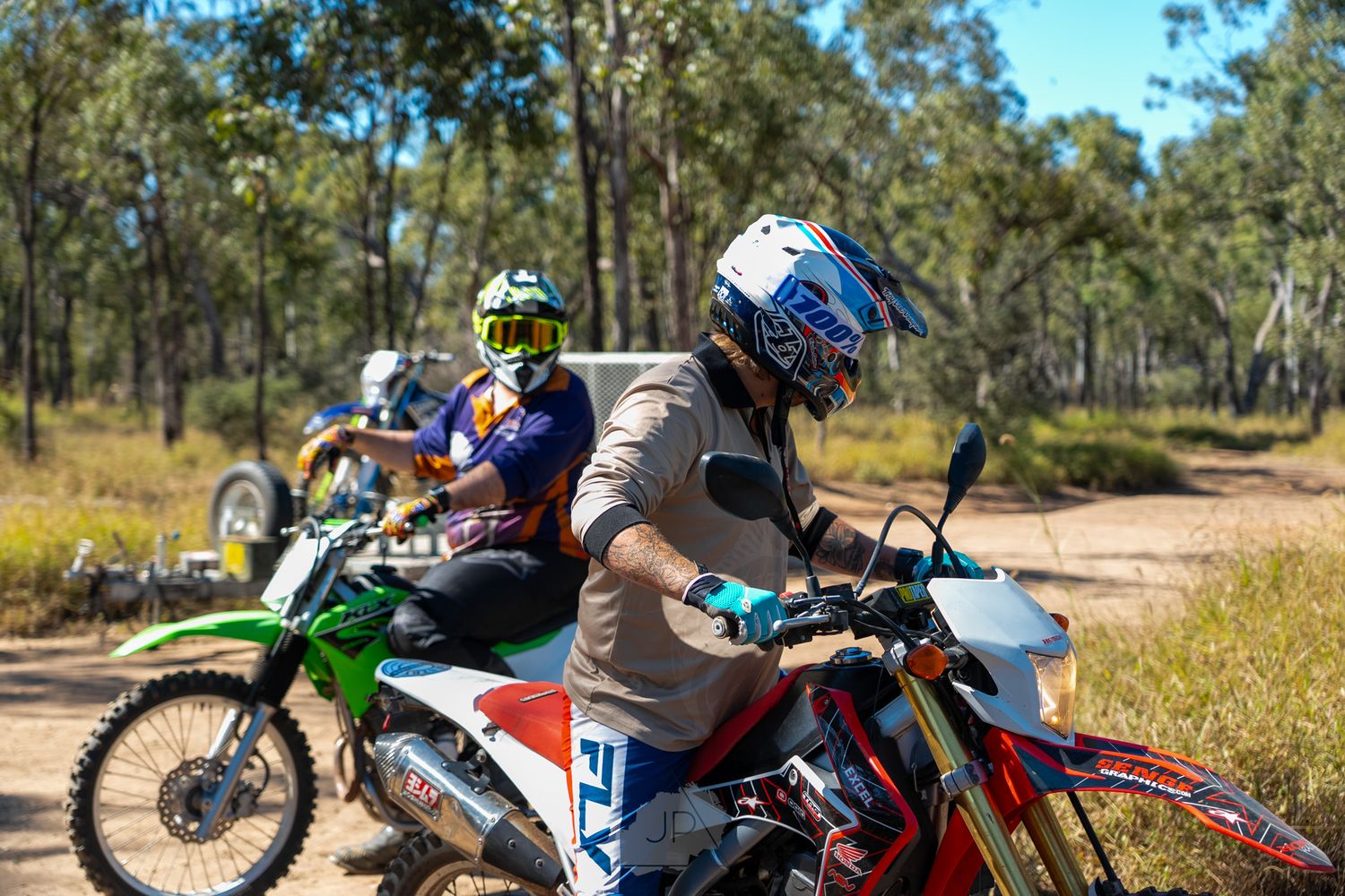 Collection of dirt bike riders navigating through dusty wooded trails showing various motocross action shots.