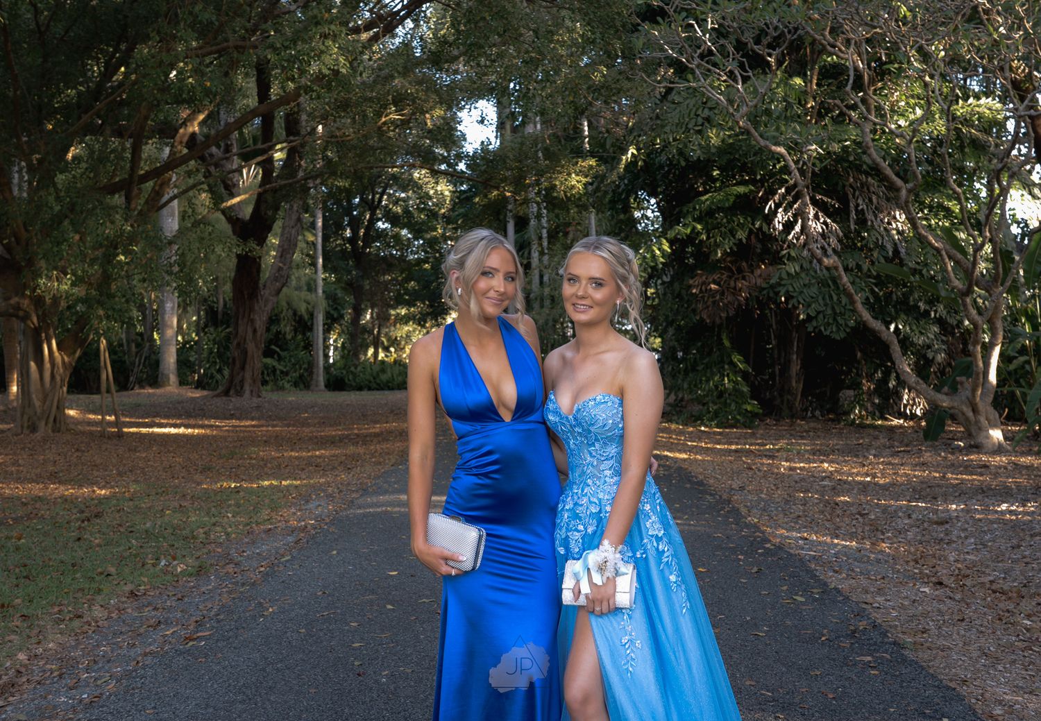 A collection of photos showing people in matching blue outfits posing outdoors in a park-like setting.