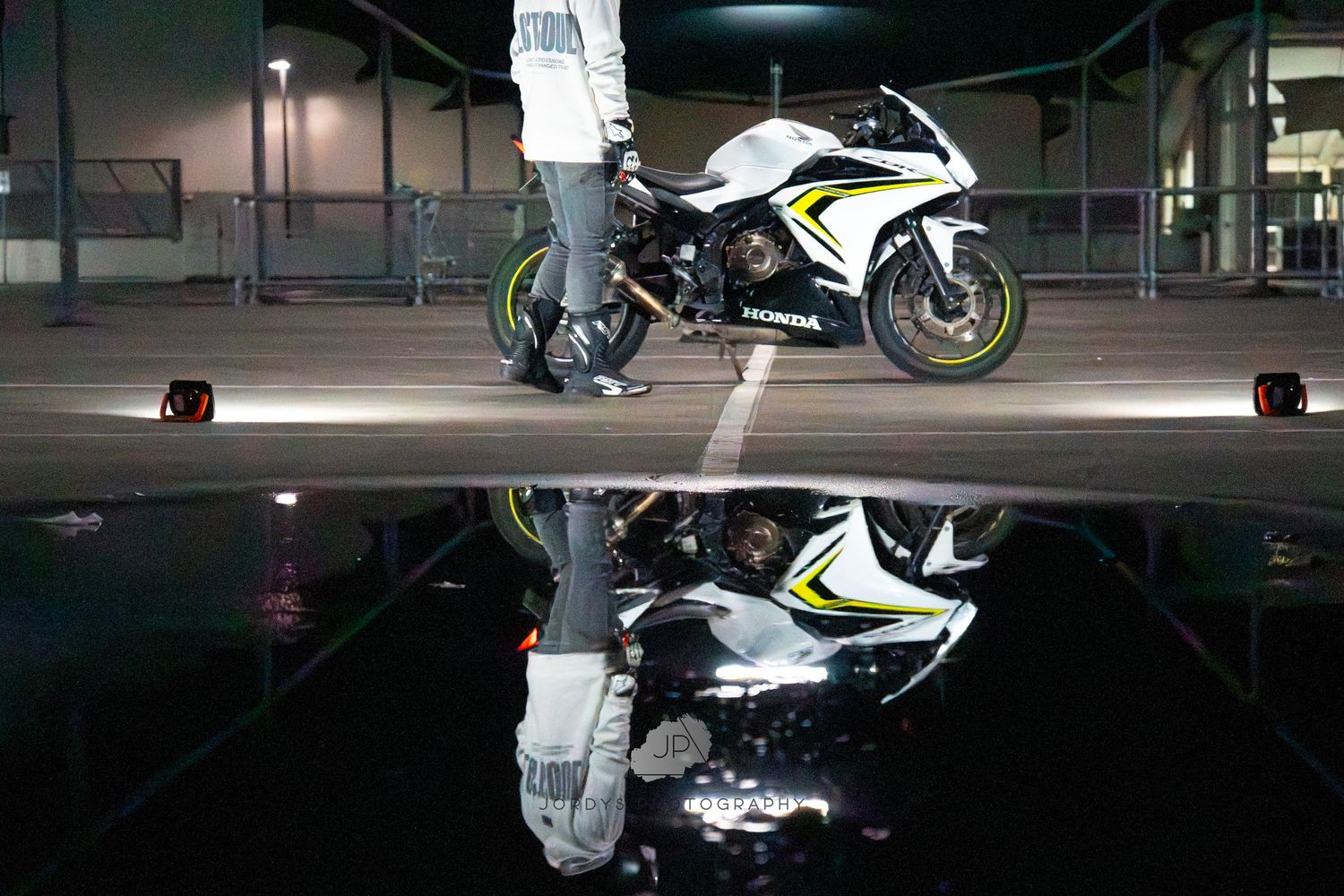 Reflection Shot of motorcyclist and his bike landscape shot