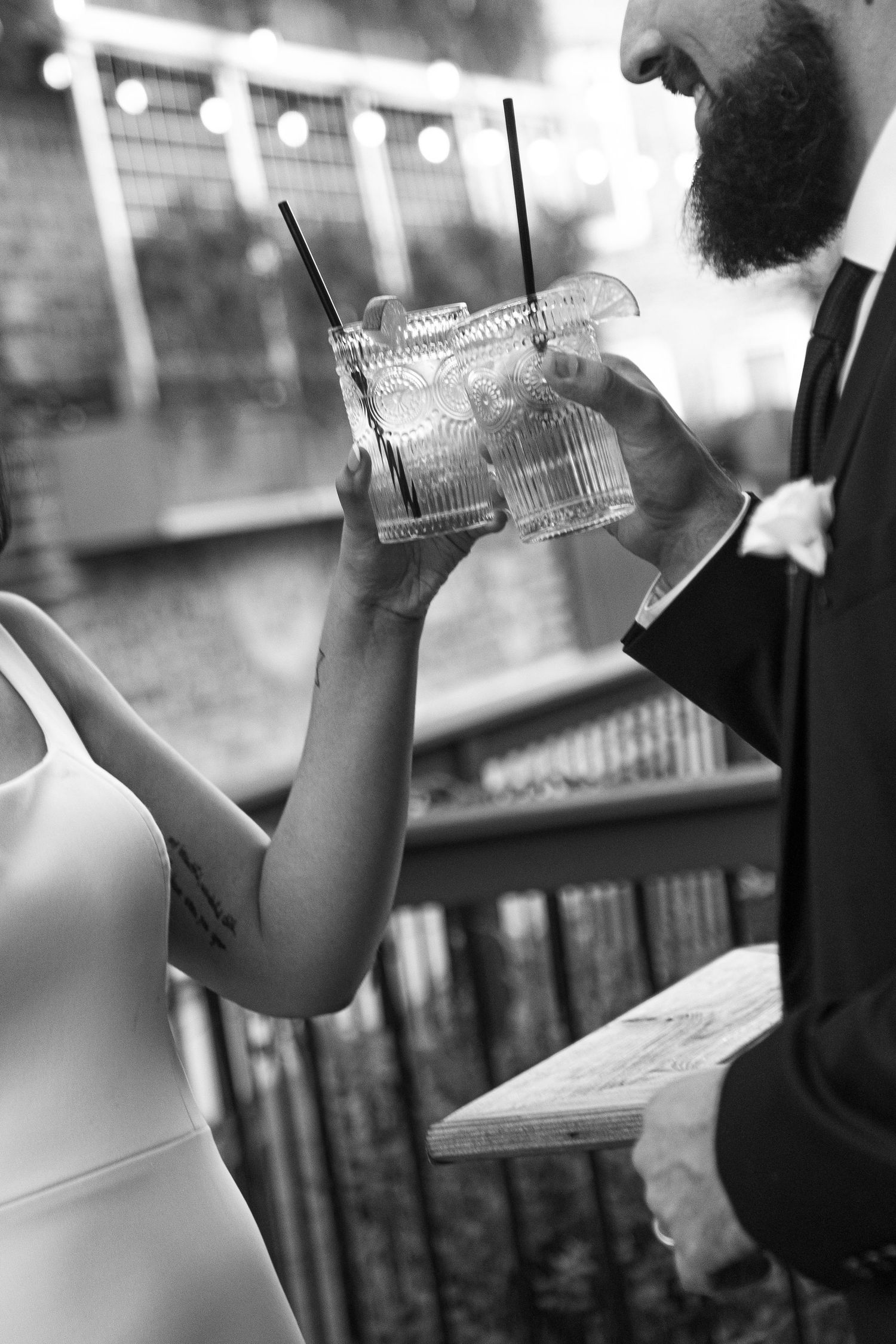 A sequence of black and white photos showing someone drinking from a plastic water bottle in an urban setting.