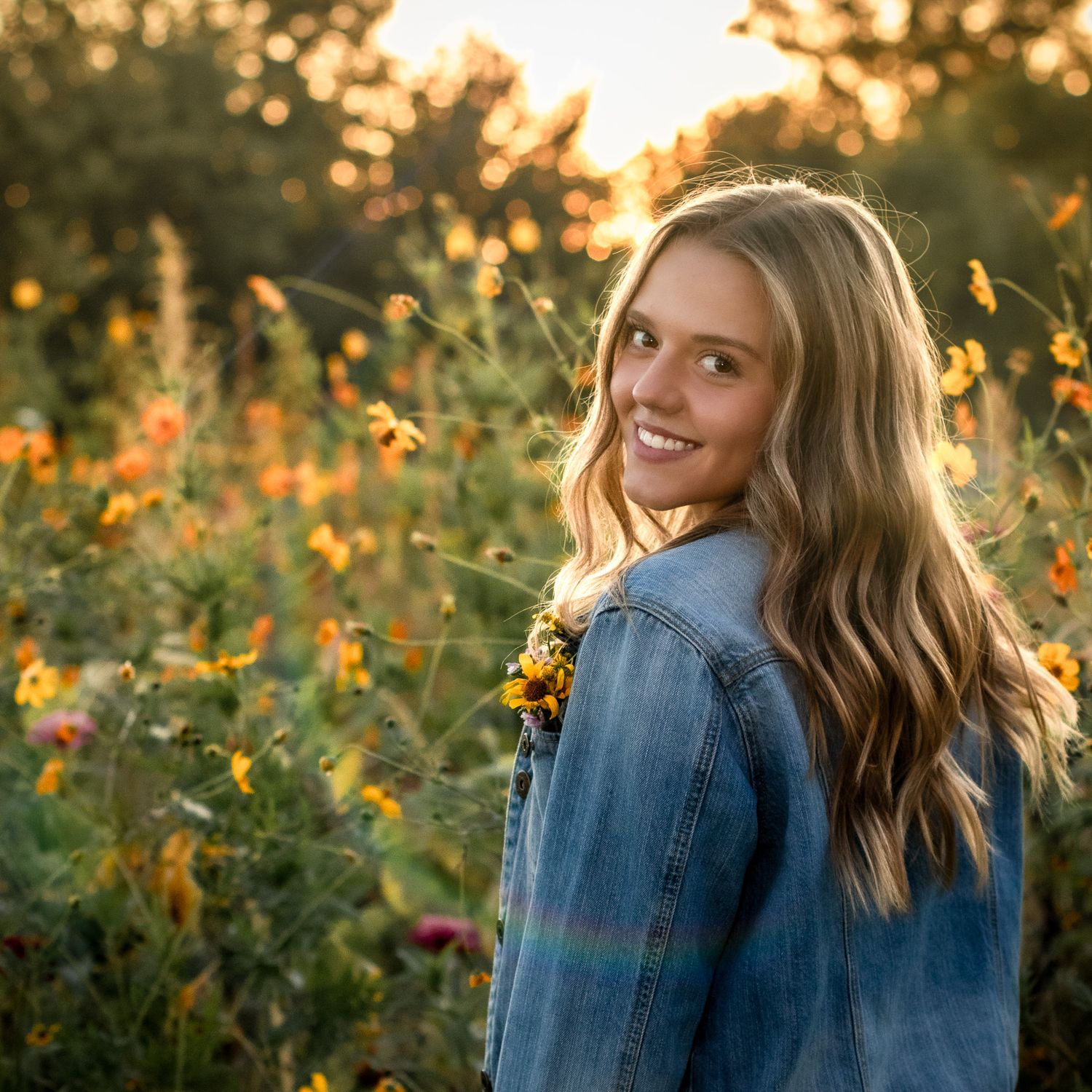 Golden hour portraits among wildflowers showing movement and natural expressions.
