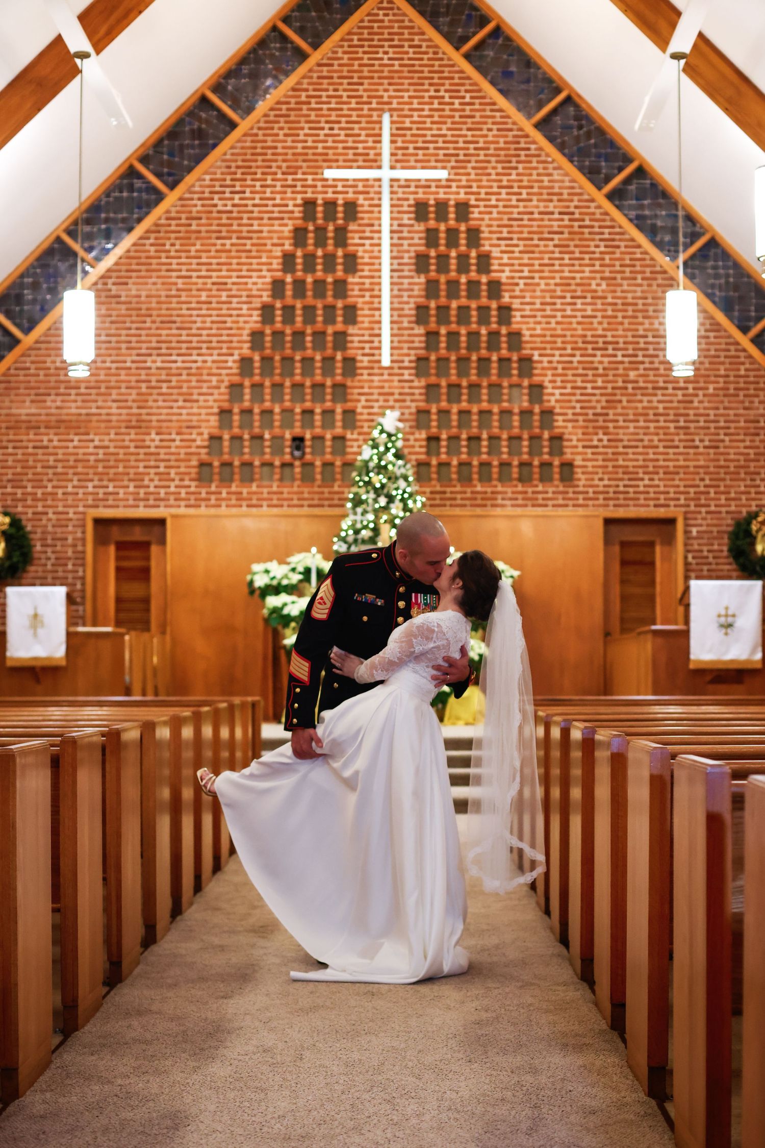 Wedding ceremony photos in a brick church with wooden pews and dramatic lighting. Alex Faye Photography Alex Faye Media Wedding Raleigh