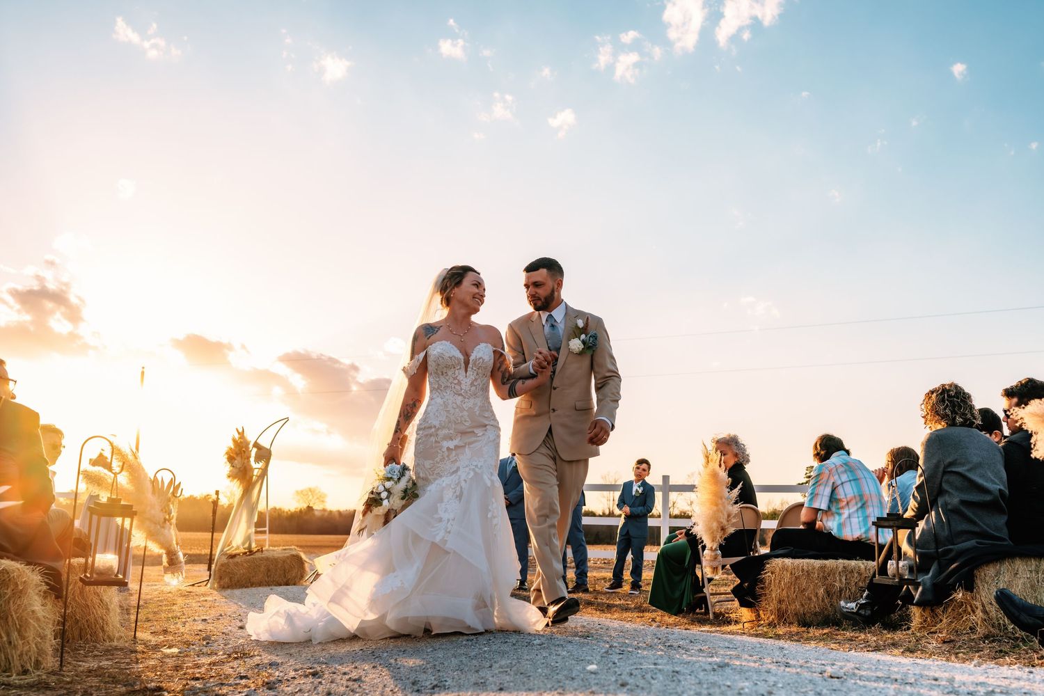 Wedding celebration silhouettes against dramatic sunset sky. Alex Faye Photography Alex Faye Media Wedding Raleigh