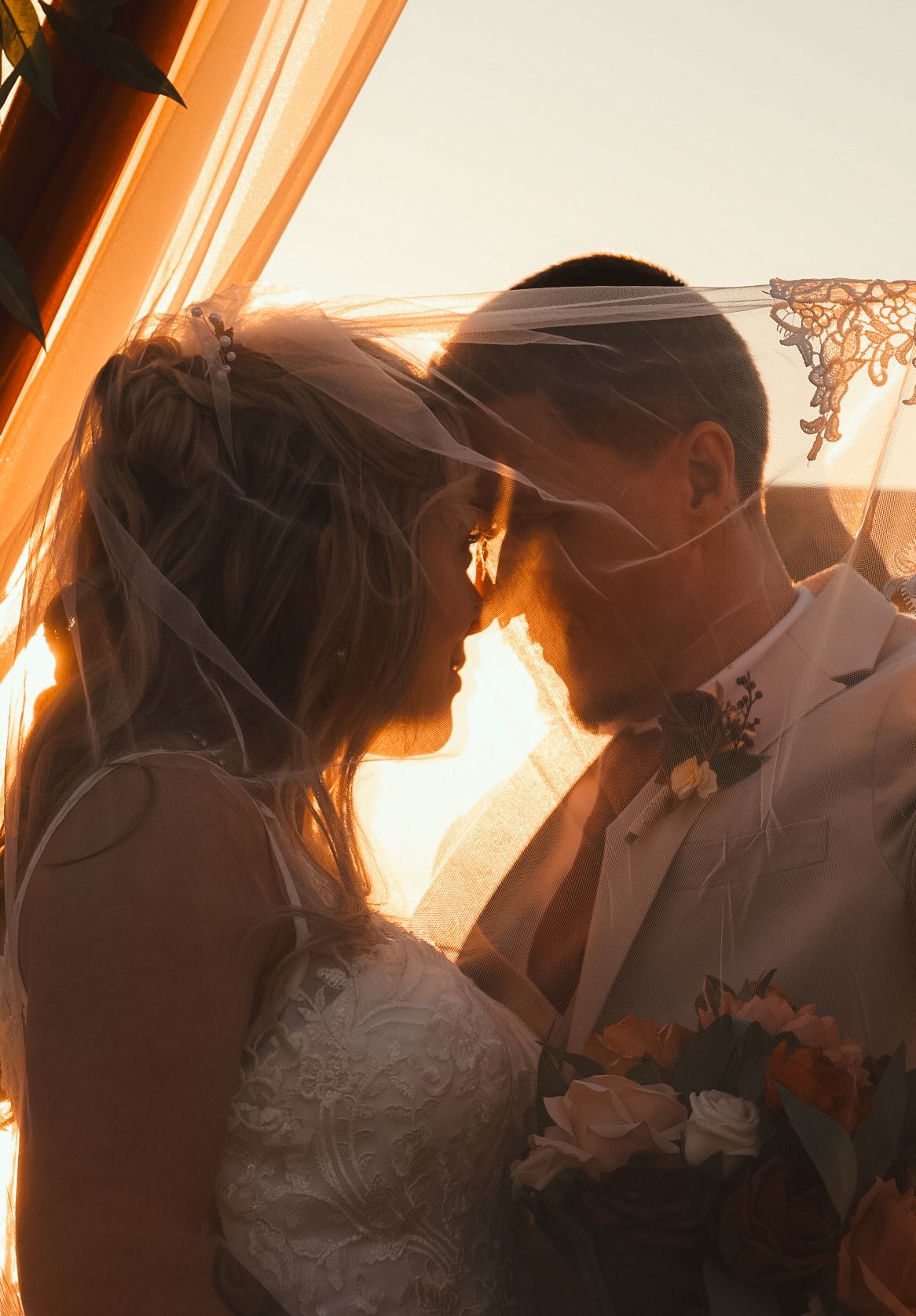 Silhouetted wedding couple sharing romantic moments at sunset. Alex Faye Photography Alex Faye Media Wedding Photographer Raleigh