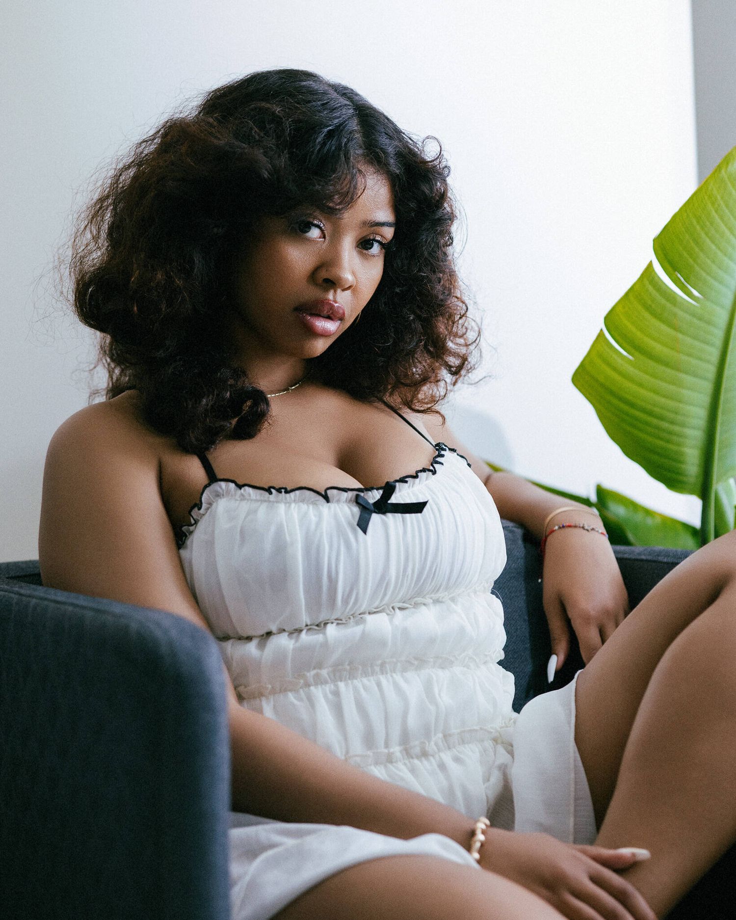 Actress Milani Jade posing for 70’s fashion-inspired editorial portraits during a professional photoshoot