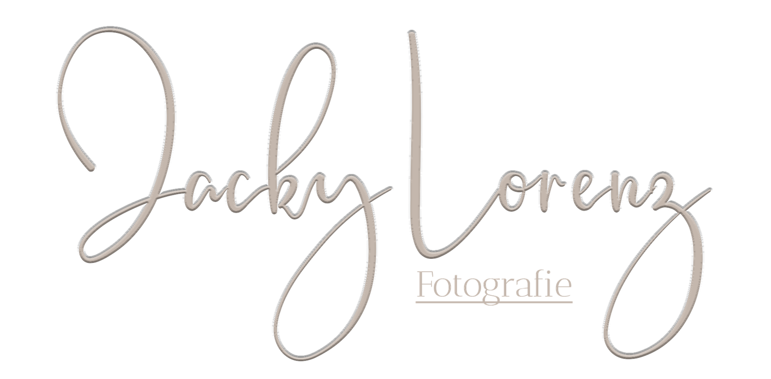 A handwritten signature in black ink appears elegantly written on a white background.