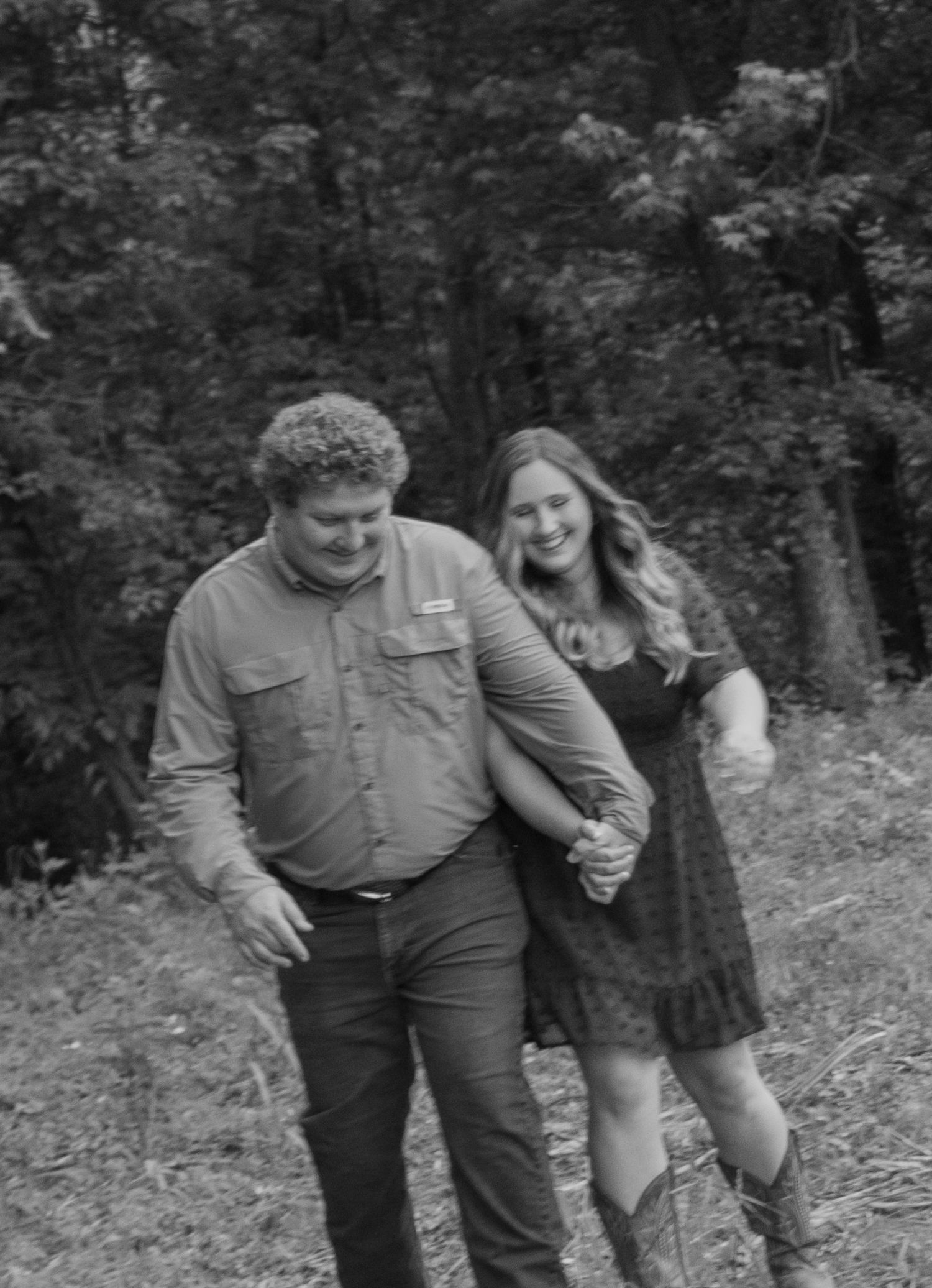 Couple smiling naturally during an outdoor portrait session