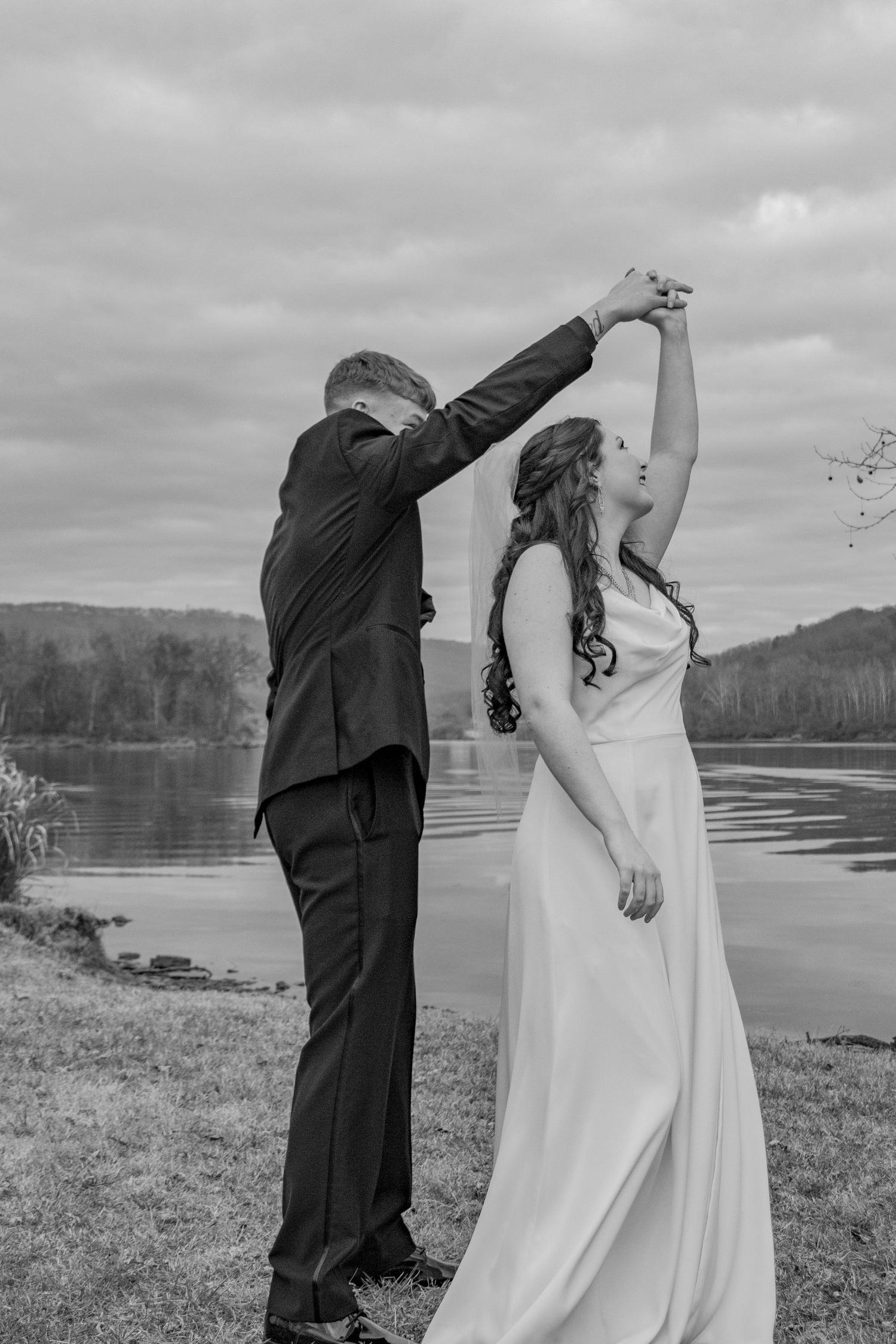 Intimate wedding portrait featuring a joyful newly married couple