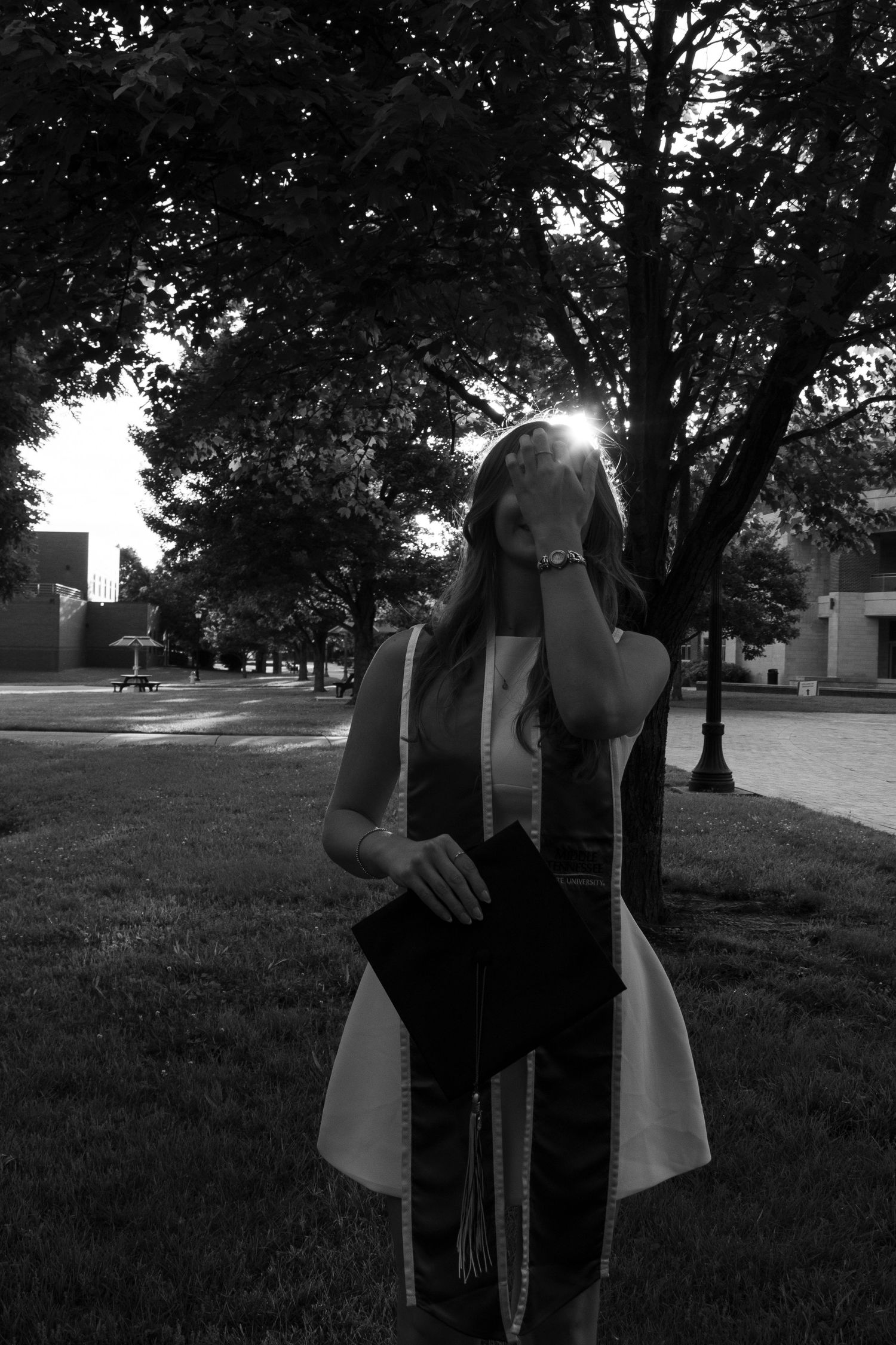 College senior celebrating graduation with candid portraits