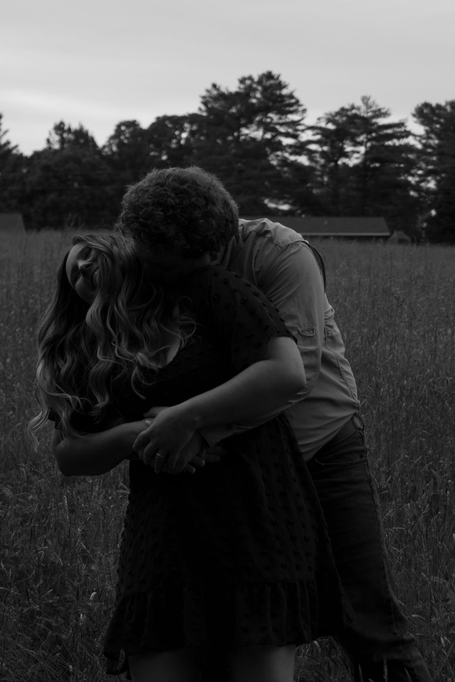 Couple wrapped in a warm embrace during an outdoor session