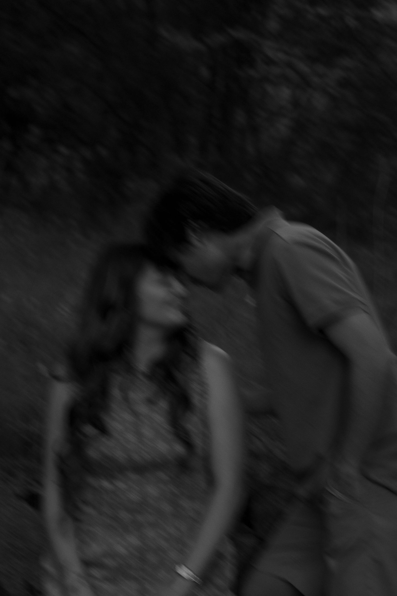 Couple wrapped in a warm embrace during an outdoor session