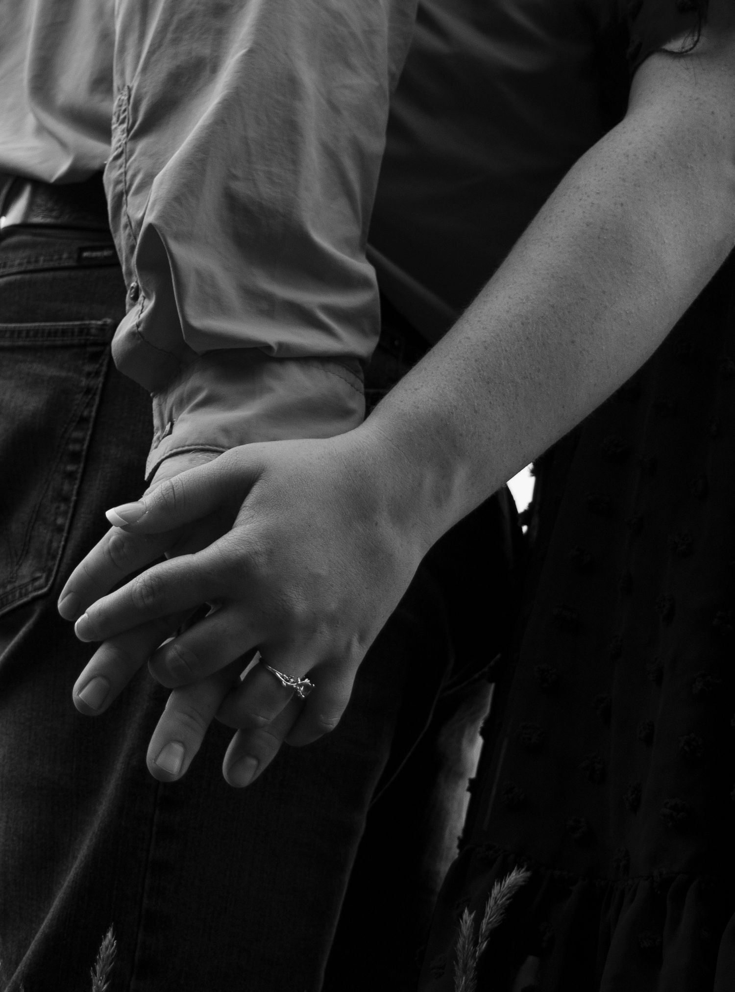 Couple Walking in a field hand in hand