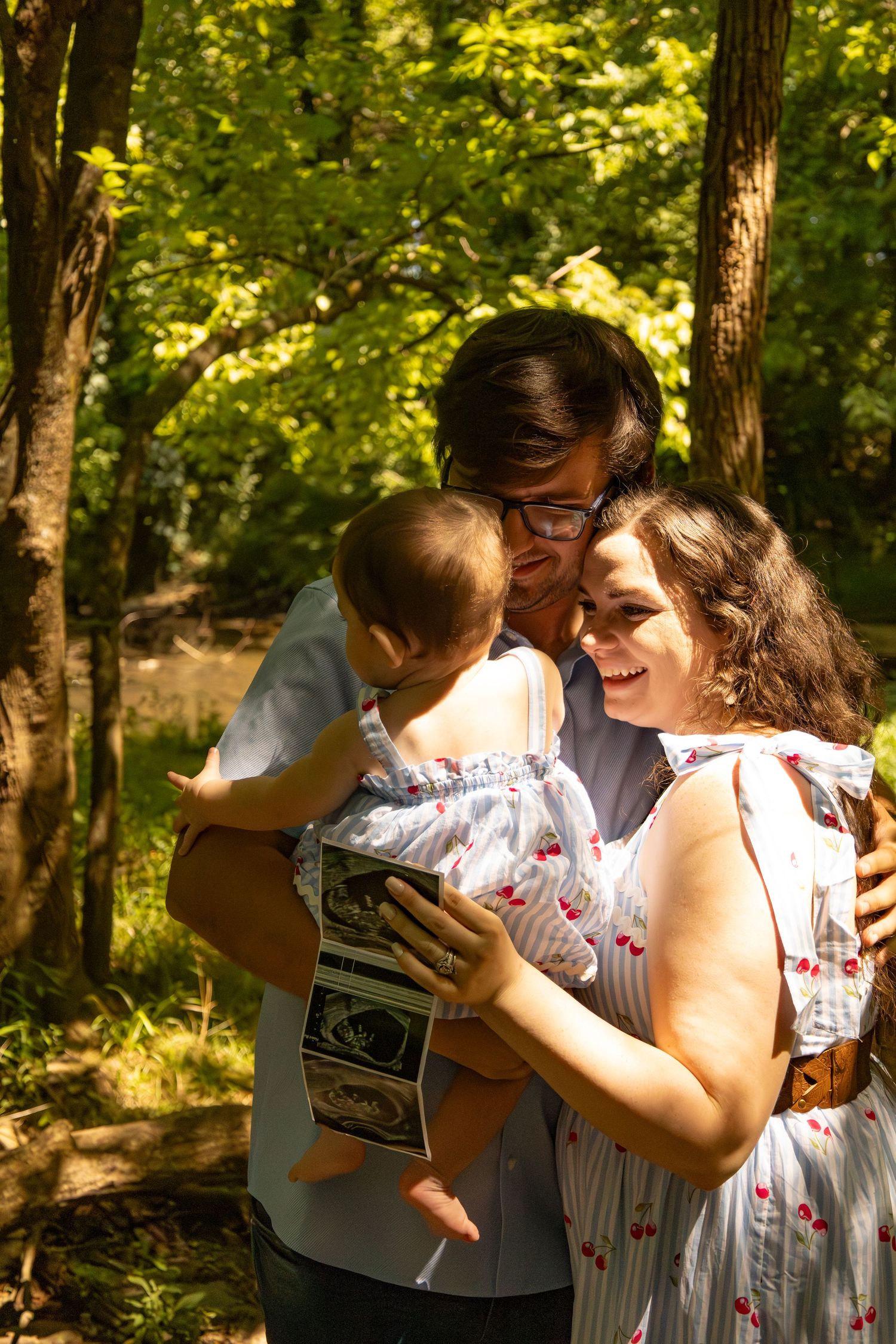 Mother holding her baby during an outdoor newborn session