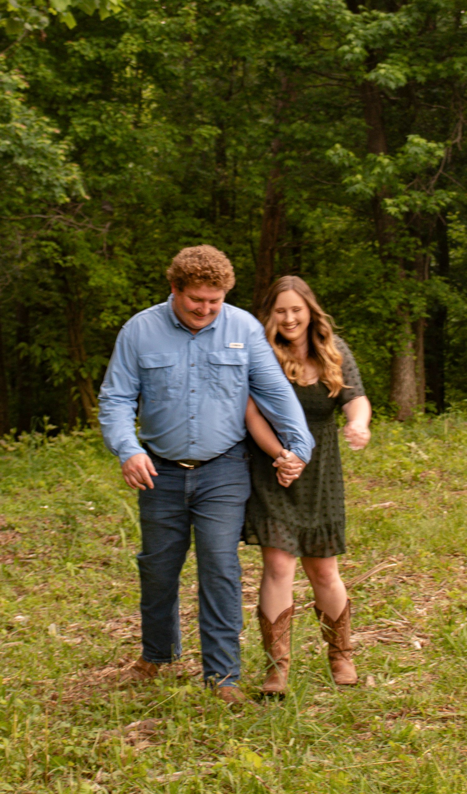 Couple Walking in a field hand in hand