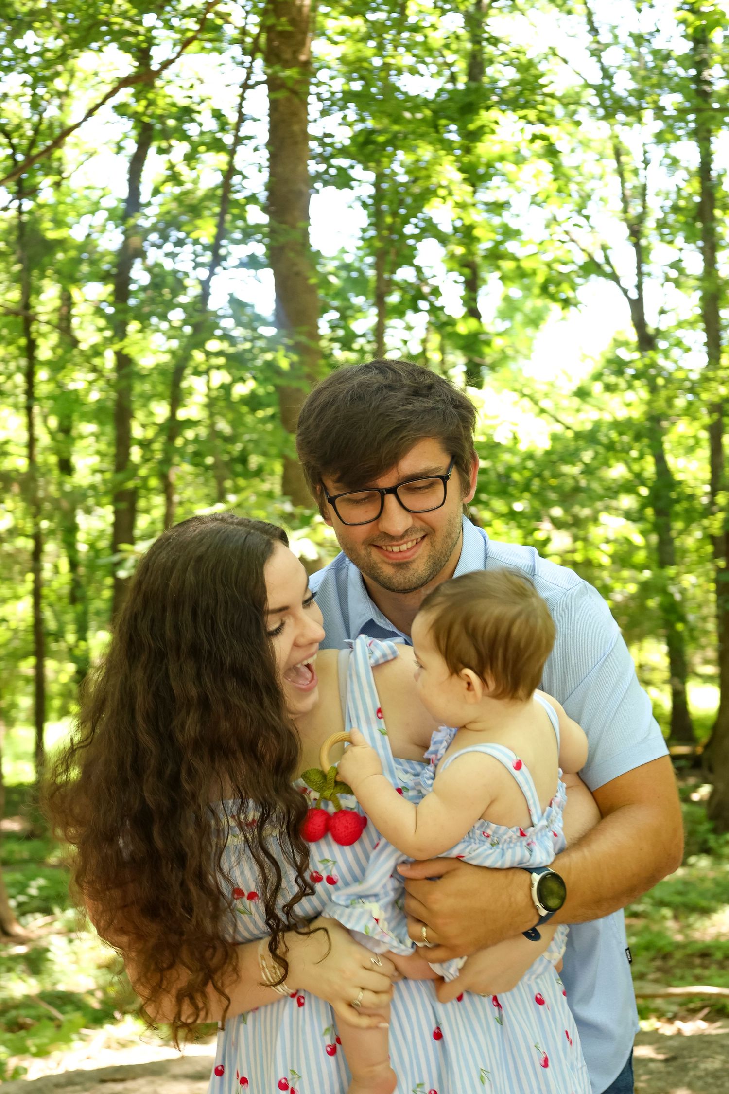 Mother holding her baby during an outdoor newborn session