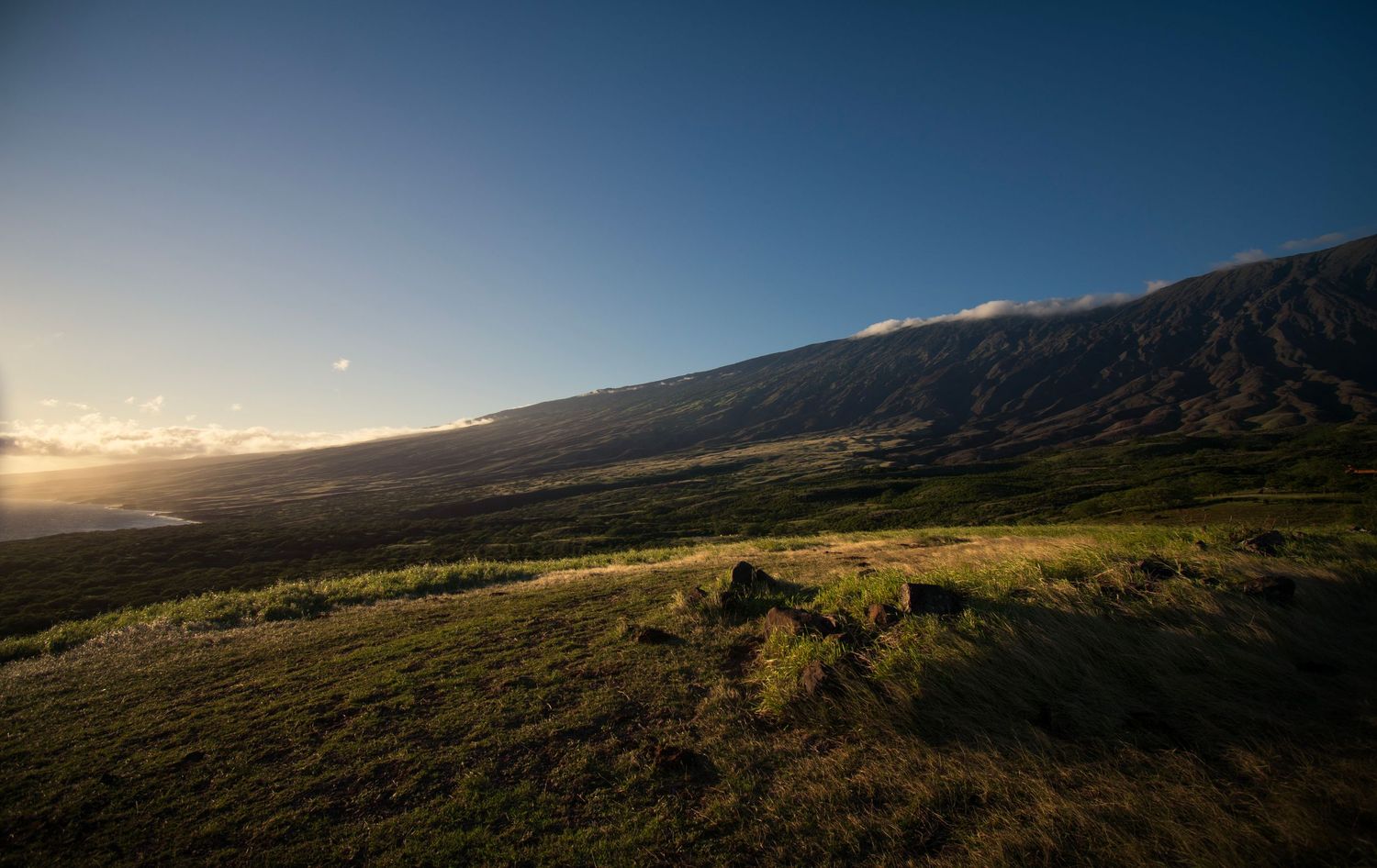A soft sunset plays on the southern Kaupo wide open slopes of Maui.