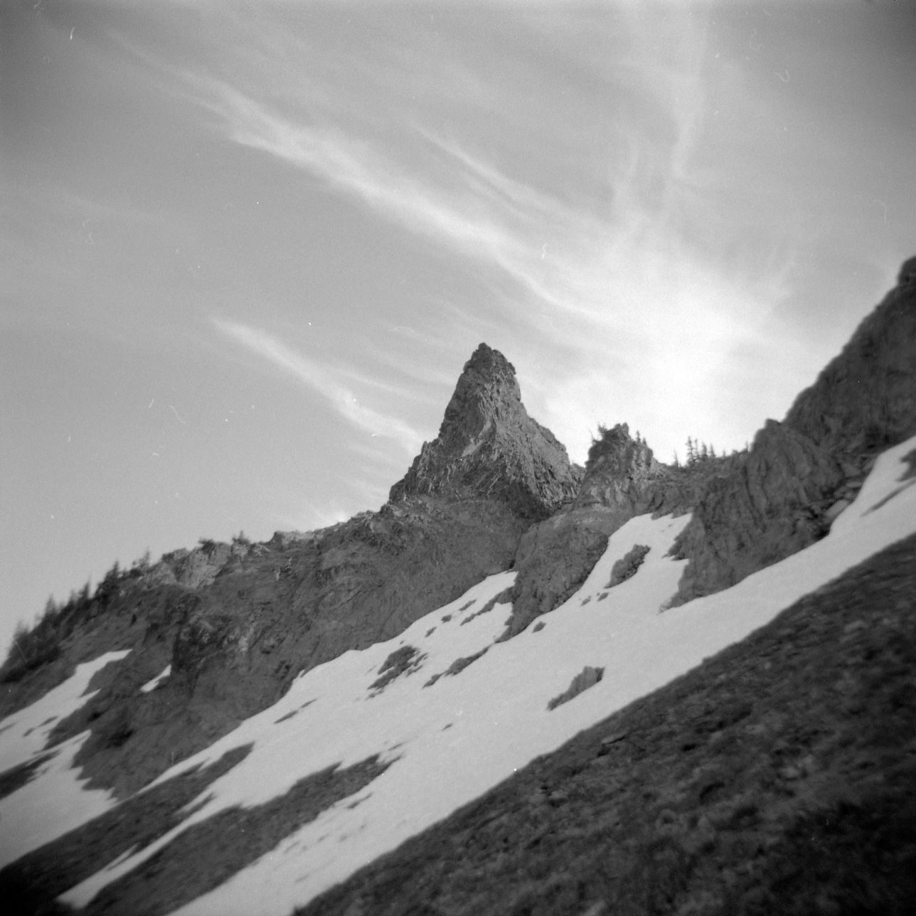 A black and white film Holga photograph of a dramatic peak in the Goat Rocks Wilderness on the Pacific Crest Trail in Washington.