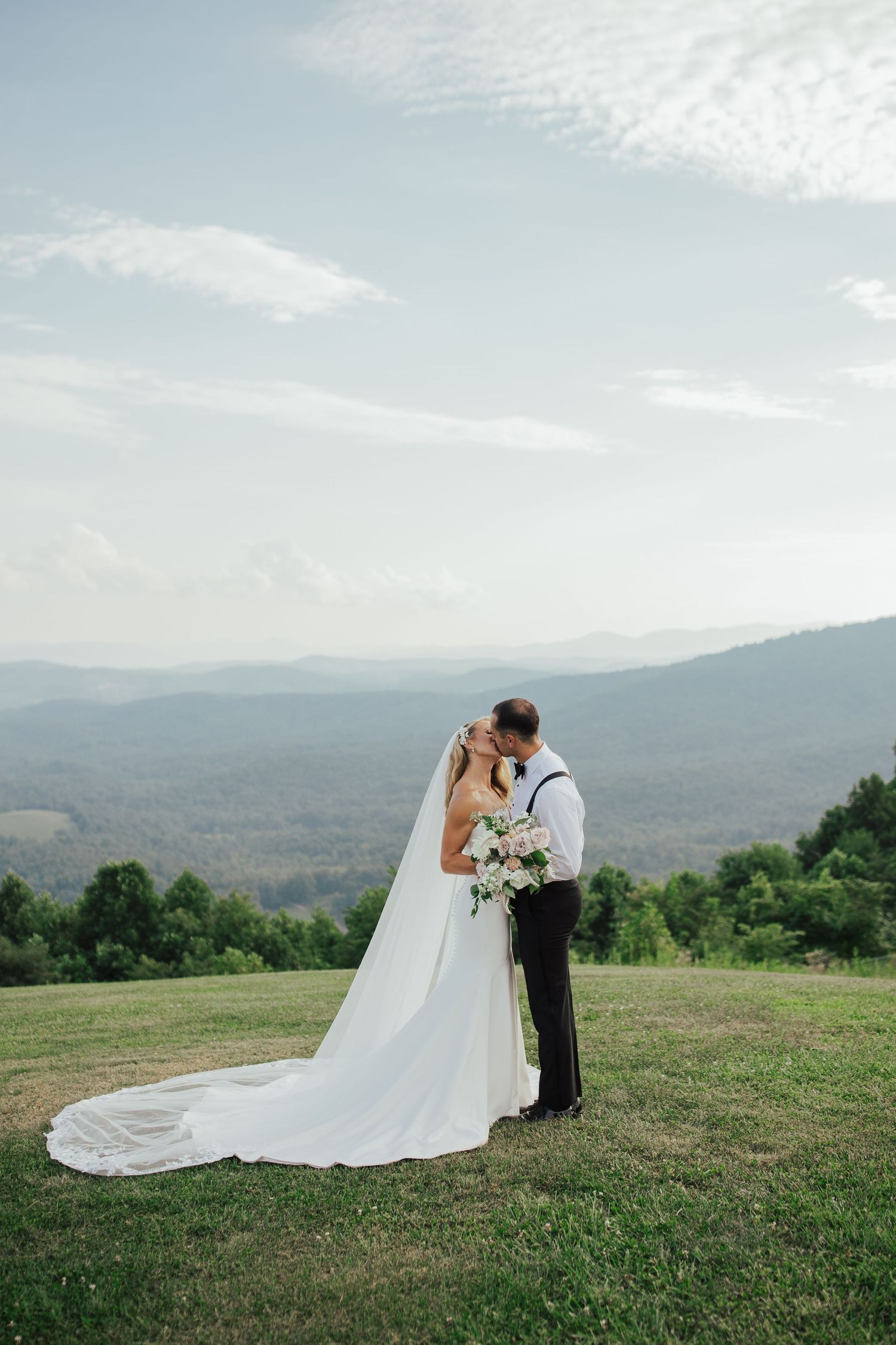 Outdoor wedding portraits bride groom mountain view sky retreat north carolina