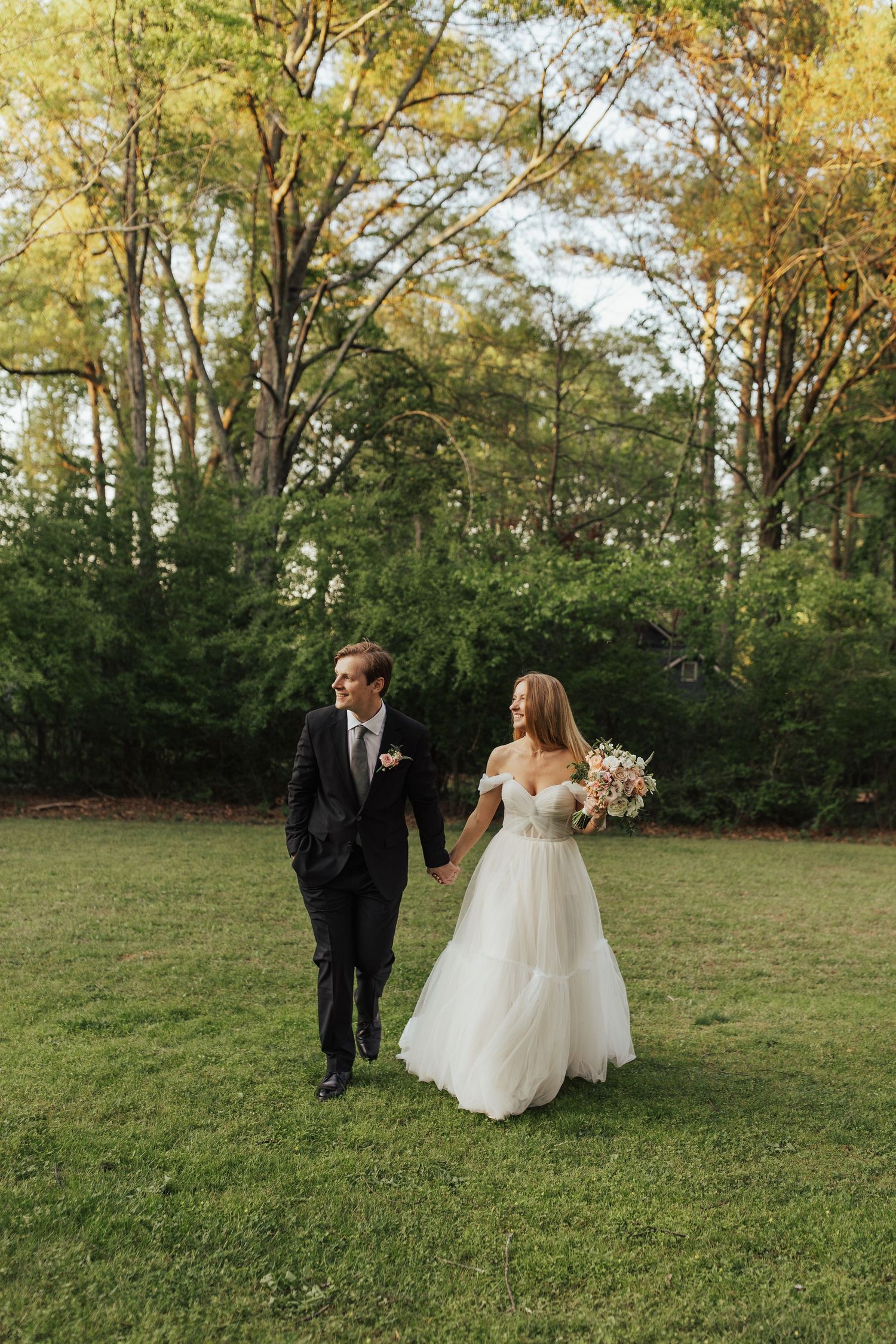 Sunset wedding portraits couple walking hand in hand chicago wedding photographer