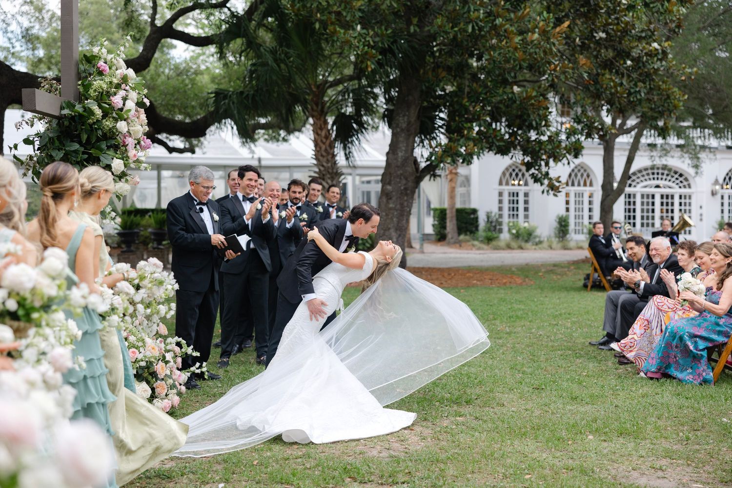 Bride and Groom sharing First Kiss at Lowndes Grove in Charleston, South Carolina