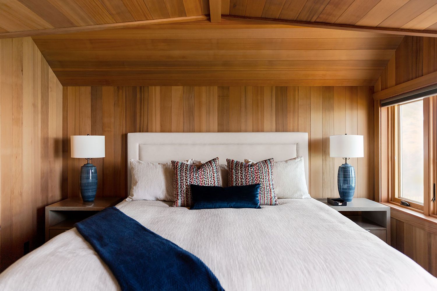 A modern wooden bedroom interior. Aspen photographer. Luxury interior photographer. Colorado commercial photographer. Editorial photographer