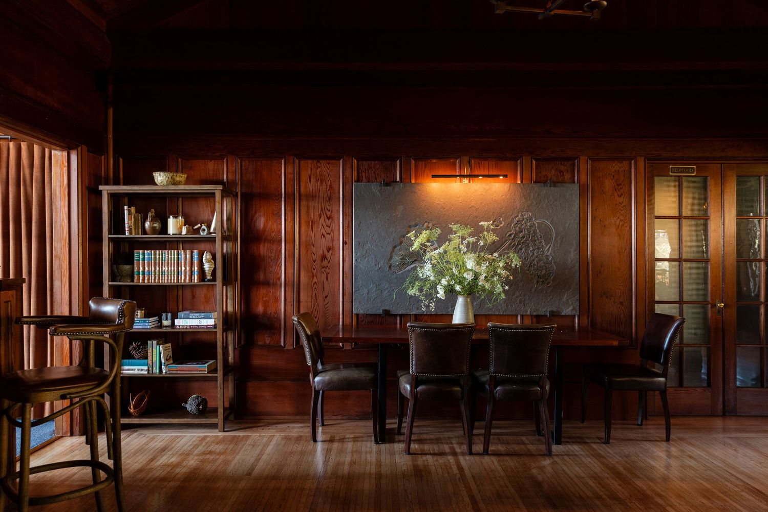 Dark wooden interior with vintage furniture. Vail, Colorado resort photographer. Hospitality lifestyle photographer for hotels and brands.