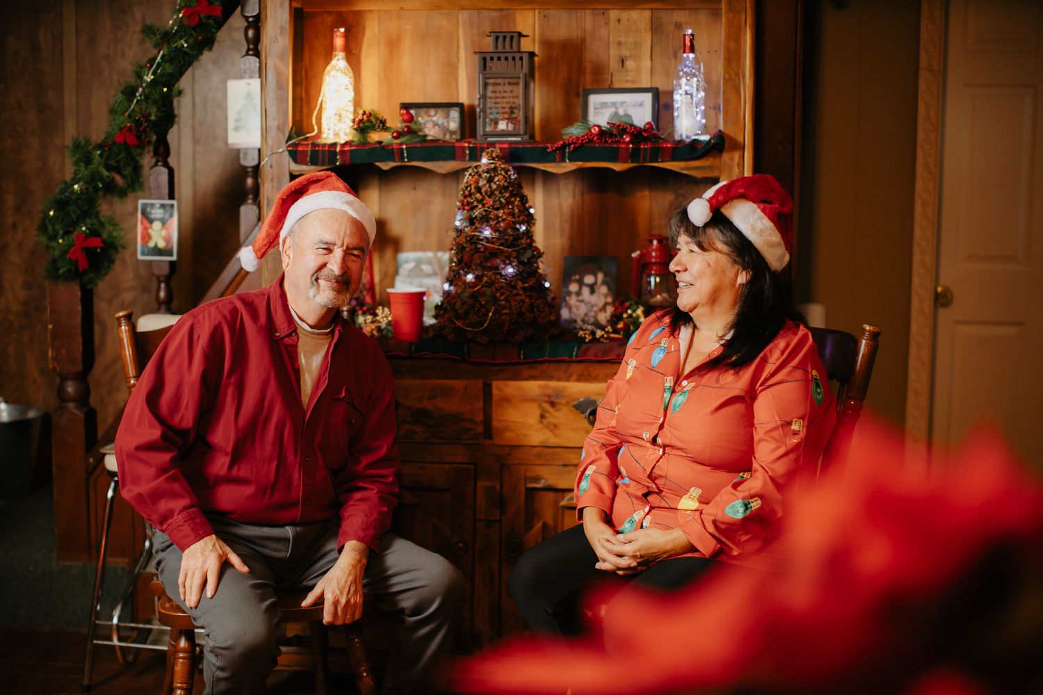 Cozy Christmas dinner scene with warm lighting and holiday decorations.
