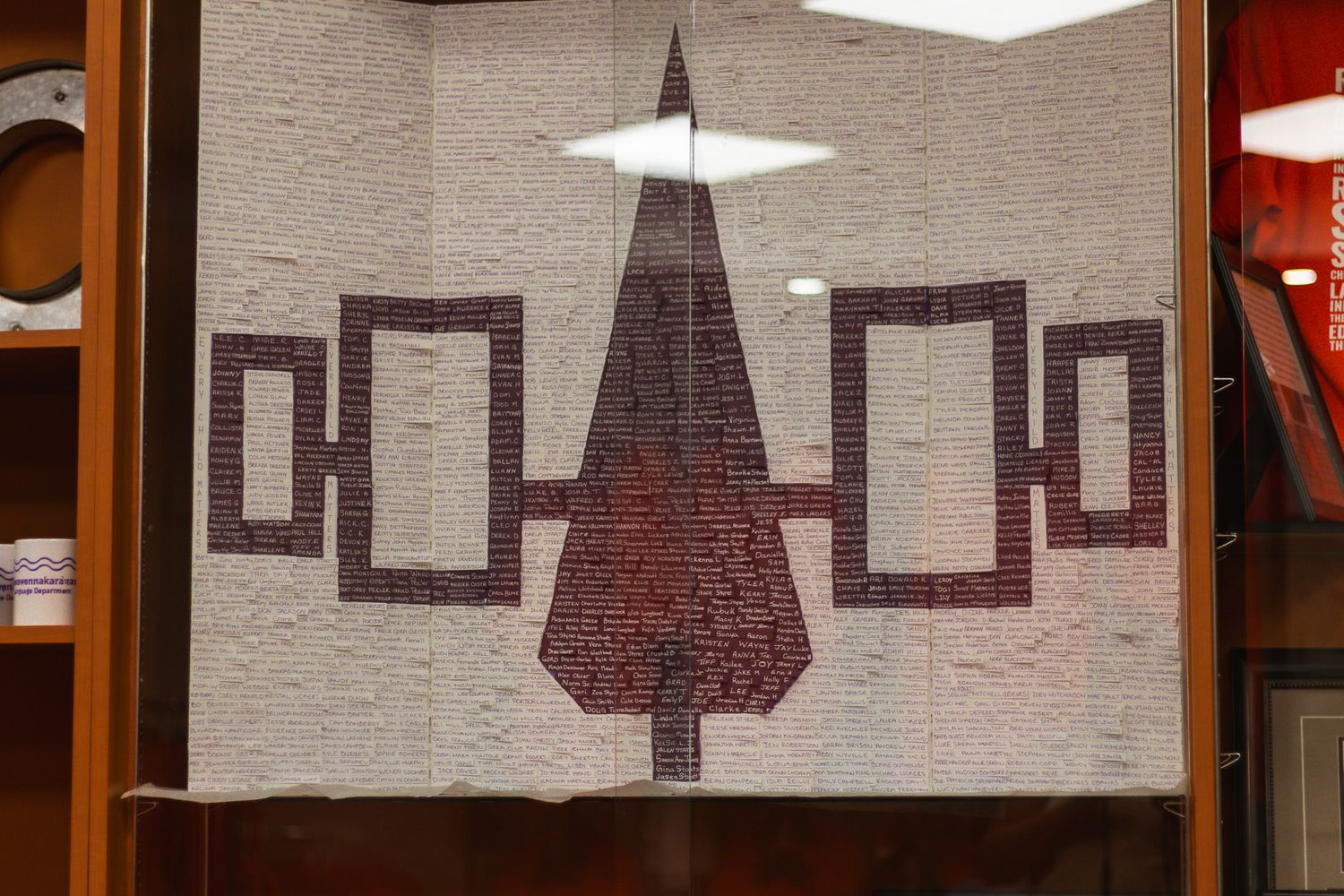 Abstract geometric wall art with squares and triangular shapes in neutral tones.