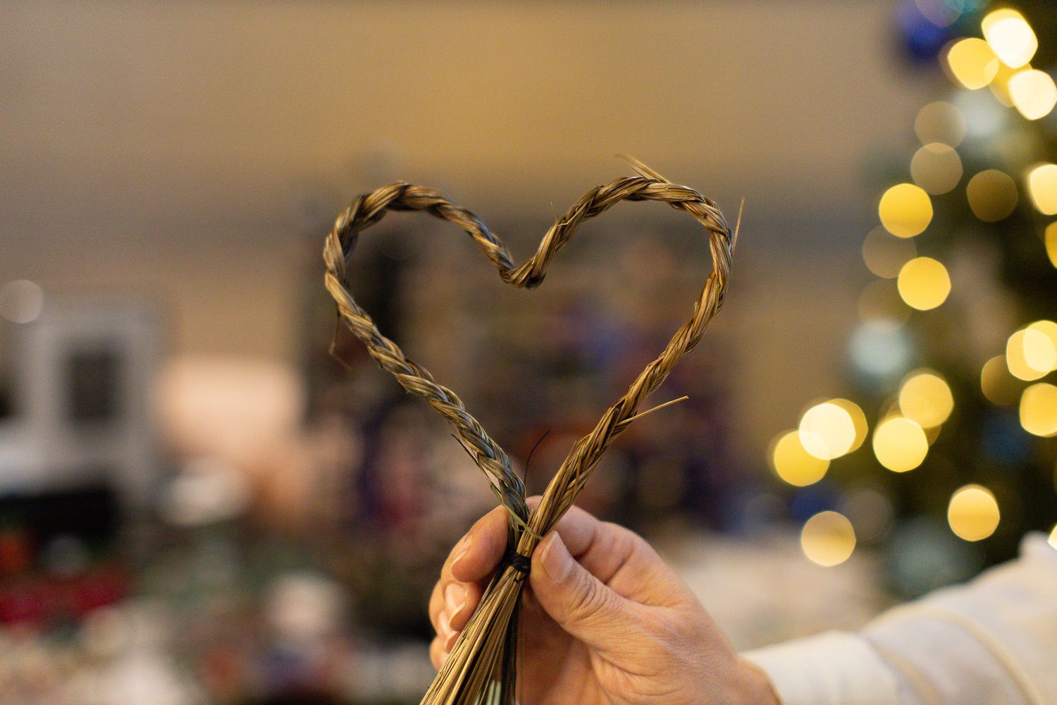 Decorative string lights creating bokeh effect against dark background.