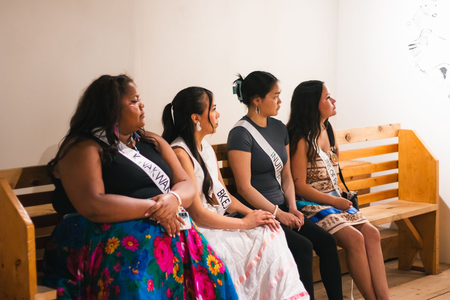 Group of attendees seated in rows at a cultural event.