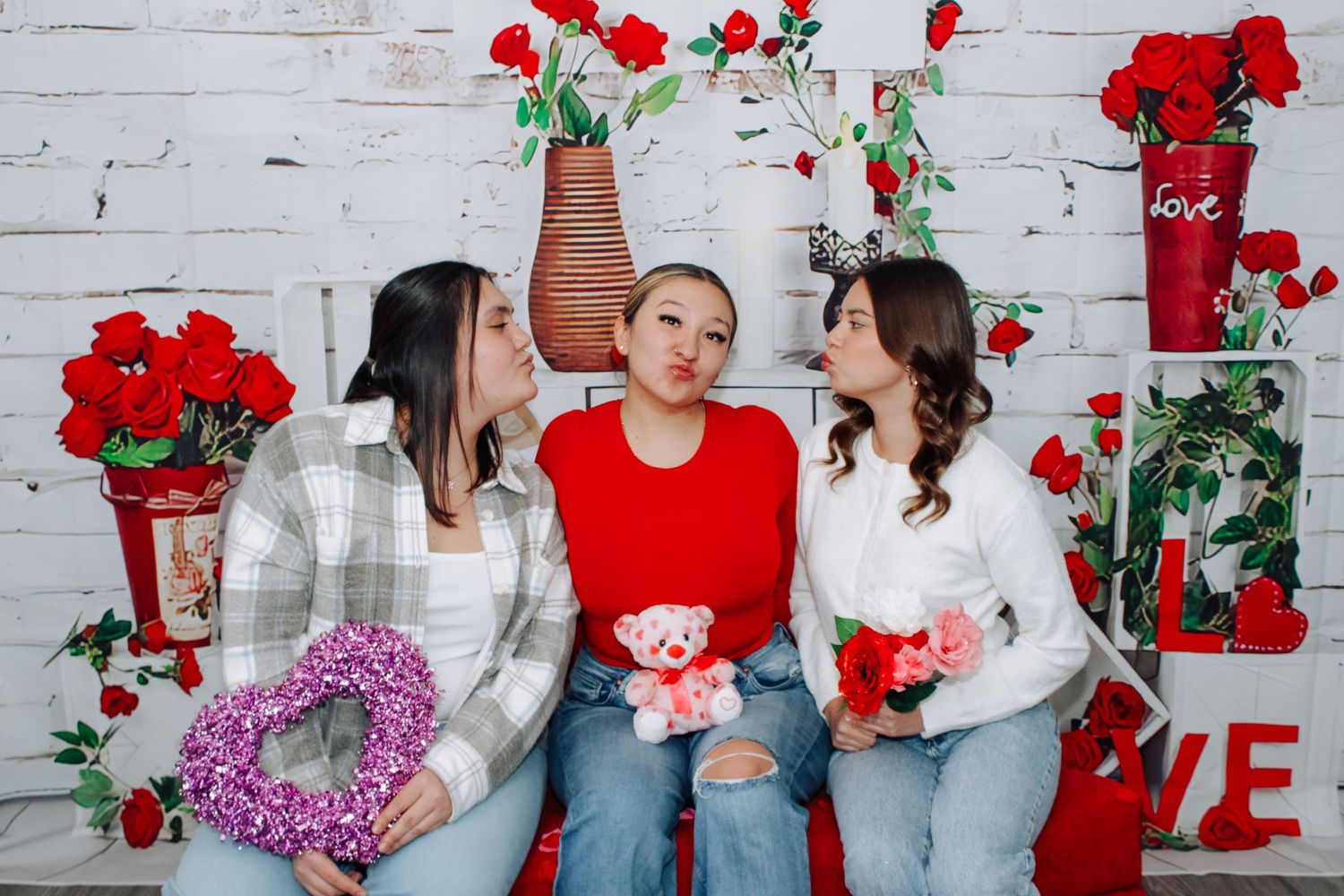 Holiday photo series with red roses and romantic decorations.