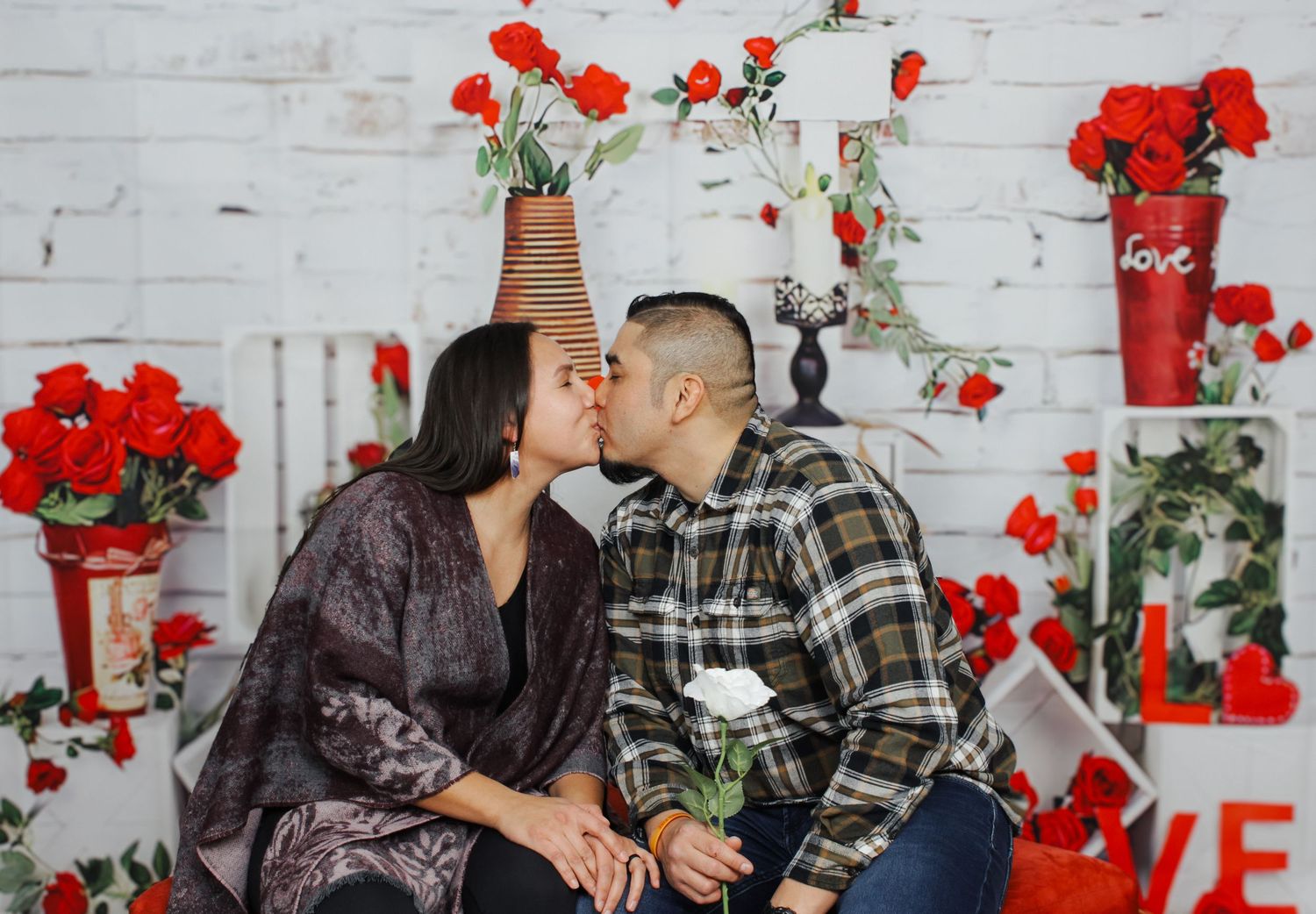 Family sharing joyful moments during Valentine's themed photography session.
