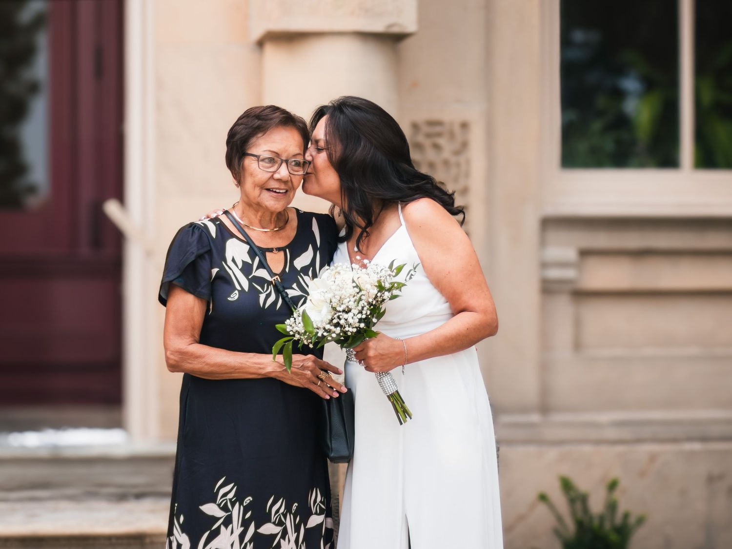 Wedding celebration on the steps of a historic building.