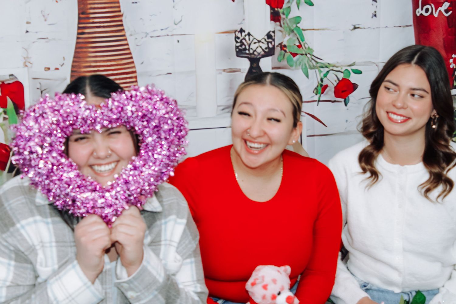 Valentine's day photo collection with pink and red heart decorations.