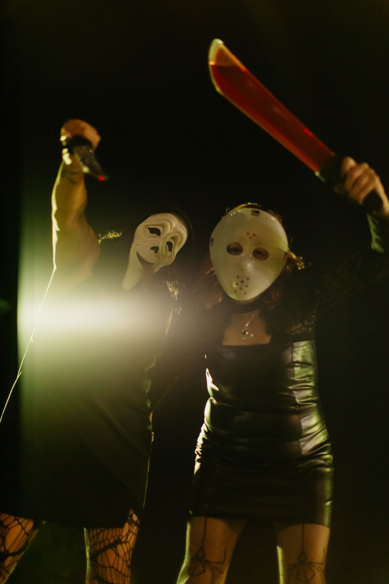 Dramatic sequence of masked figures in black clothing holding knives against dark background with atmospheric lighting.