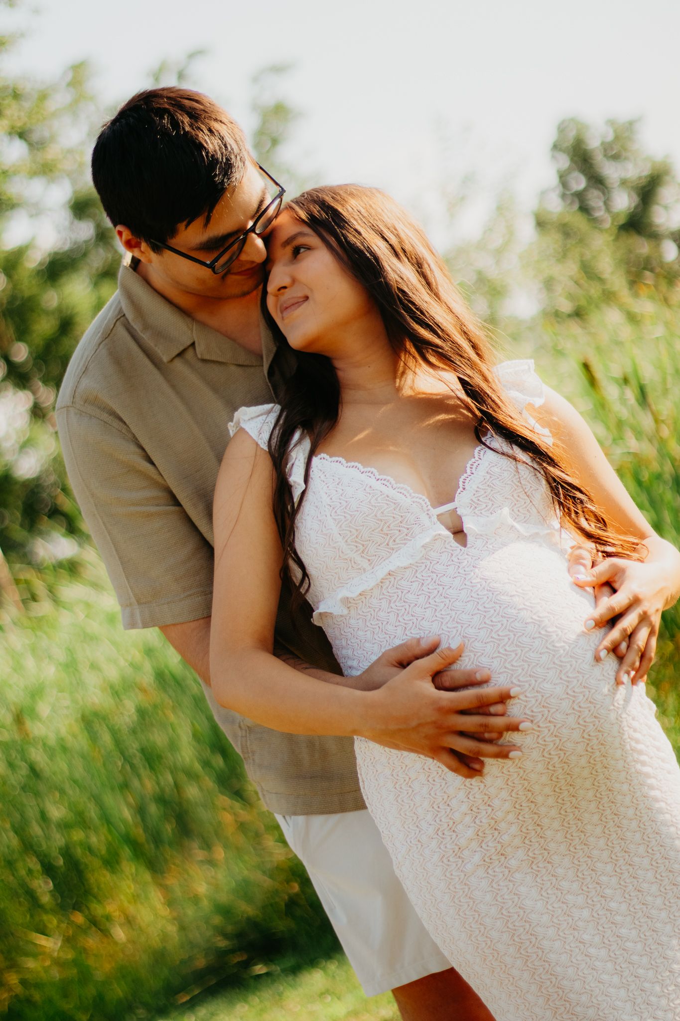 Sweet maternity photography sequence capturing tender moments between a couple in an outdoor setting.