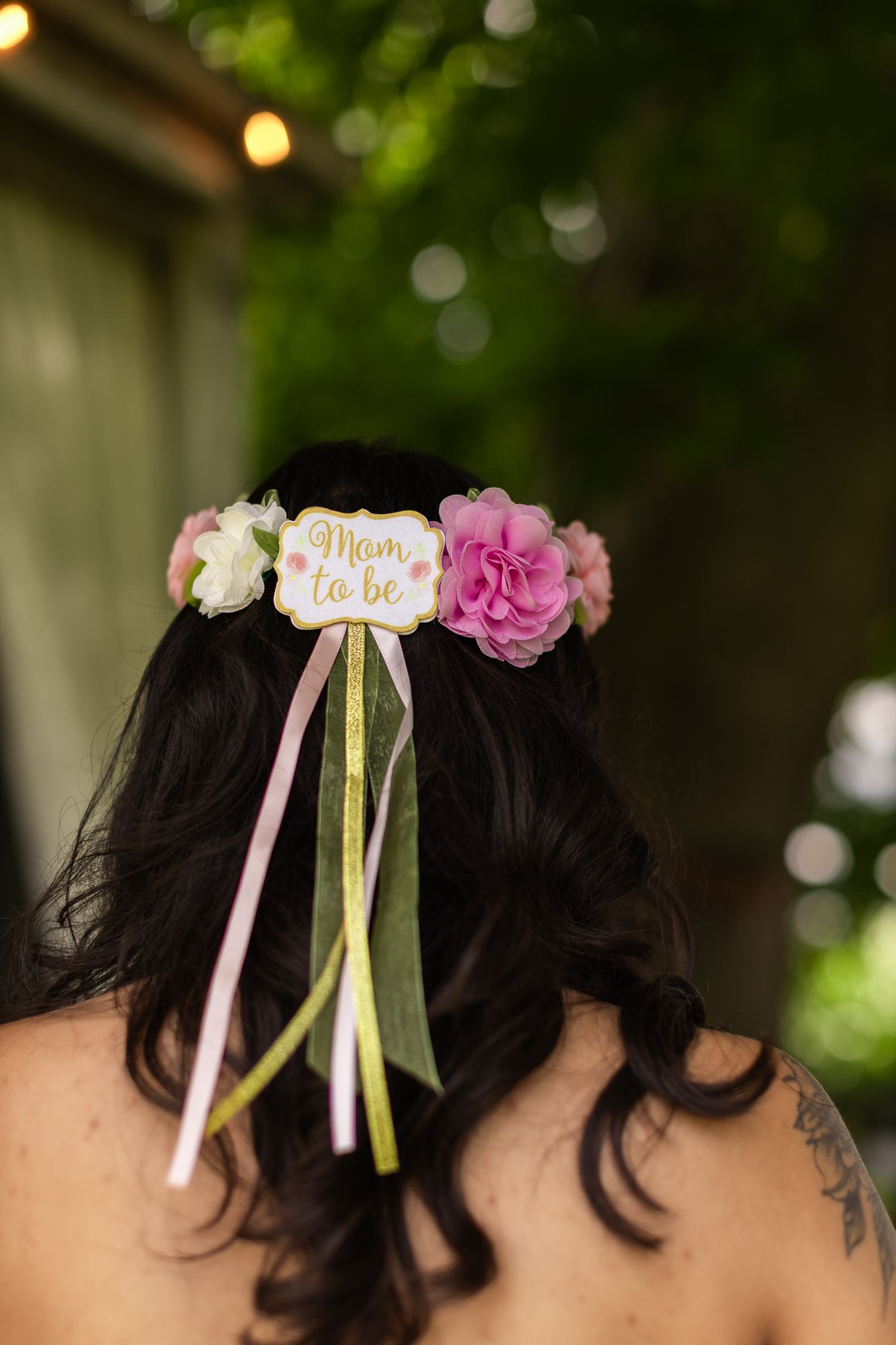 Decorative hair accessories with ribbons and flowers in pink and yellow colors.